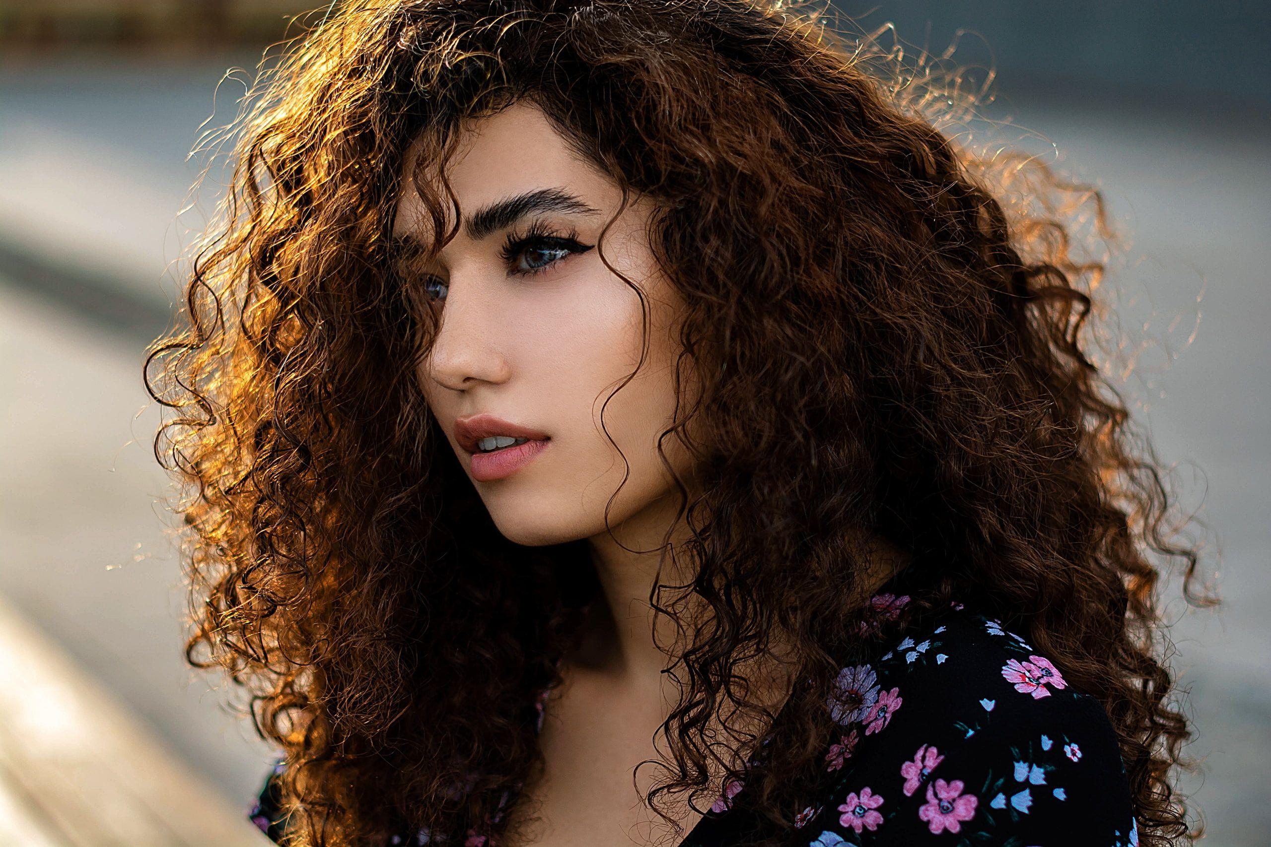 2560x1707 women #model #brunette curly hair #outdoors depth of field #face #dress #portrait looking away hair in face. Curly hair styles, Depth of field, Sheer floral top