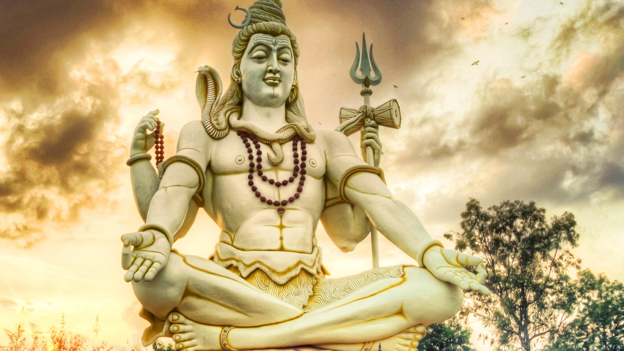 2560x1440 Shiva Statue In Black Cloudy Sky Background HD Shiva Wallpaper