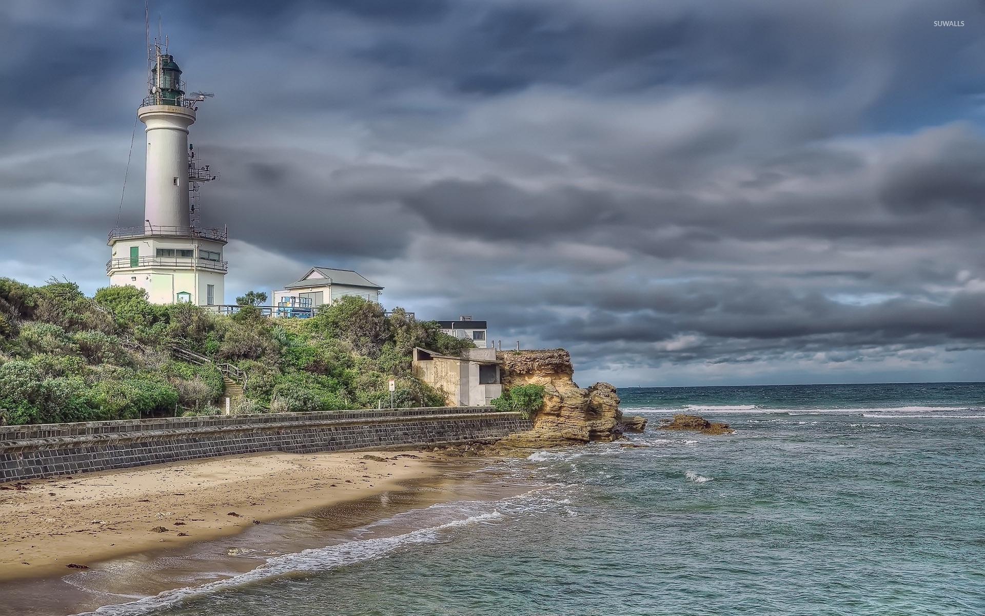 1920x1200 Gray clouds over the lighthouse wallpaper wallpaper