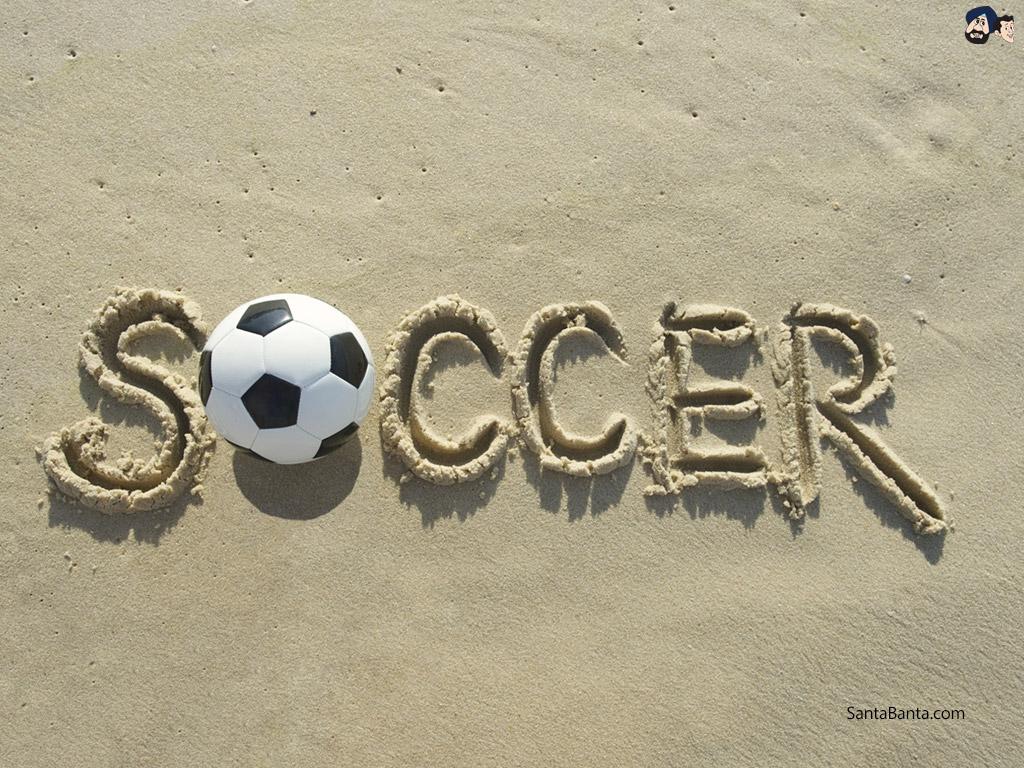 1024x768 Soccer ball on beach