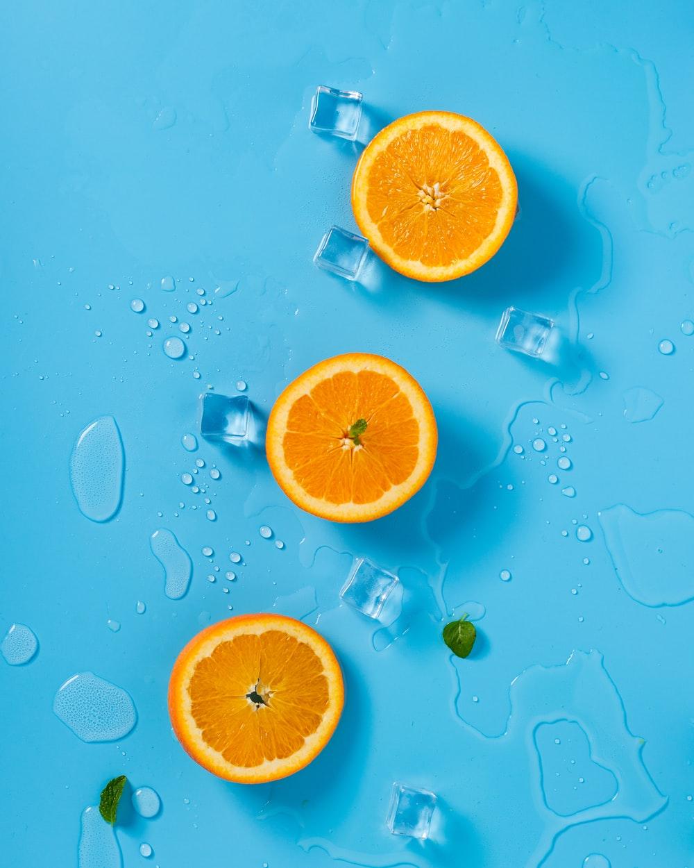 1000x1250 three sliced citrus oranges photo
