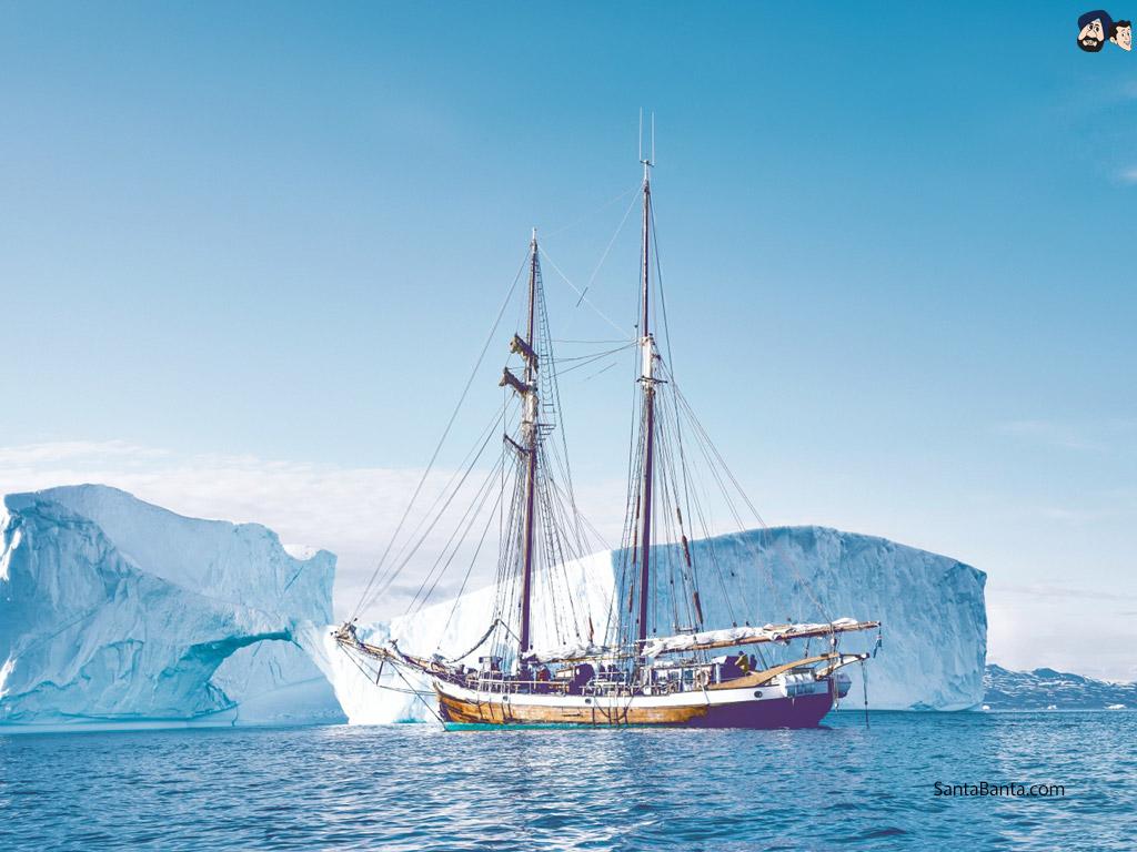1024x768 Sailing Ship with icebergs in the backdrop