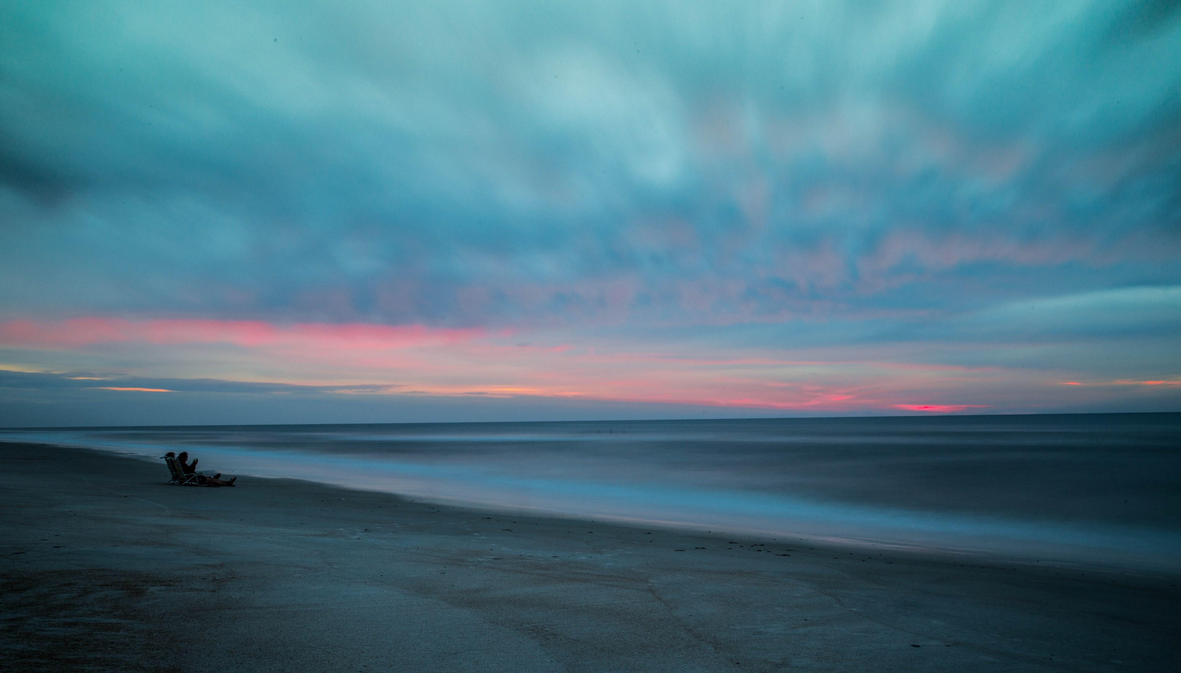 3840x2189 Wallpaper / people on the sandy beach after the sunset at saint augustine beach, watercolor summer sunrise 4k wallpaper