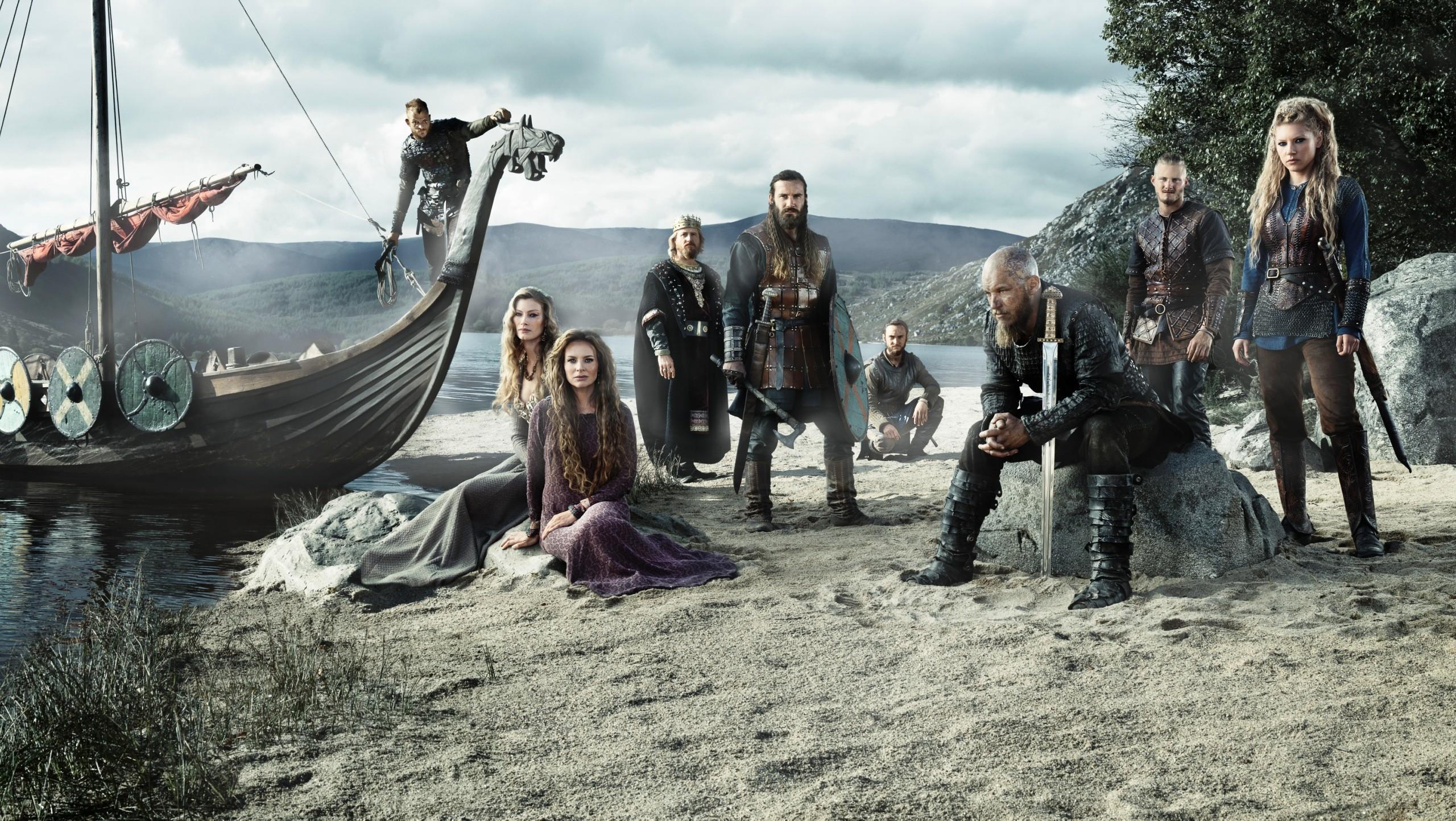 2560x1444 #women, #men, #Alyssa Sutherland, #sword, #Jessalyn Gilsig, #Ragnar Lodbrok, #Lagertha Lothbrok, #Katheryn Winnick, #Rollo Lothbrok, #Vikings (TV series), #TV, #Vikings, #boat, #Travis Fimmel, #warrior, #Clive Standen, wallpaper. Mocah HD