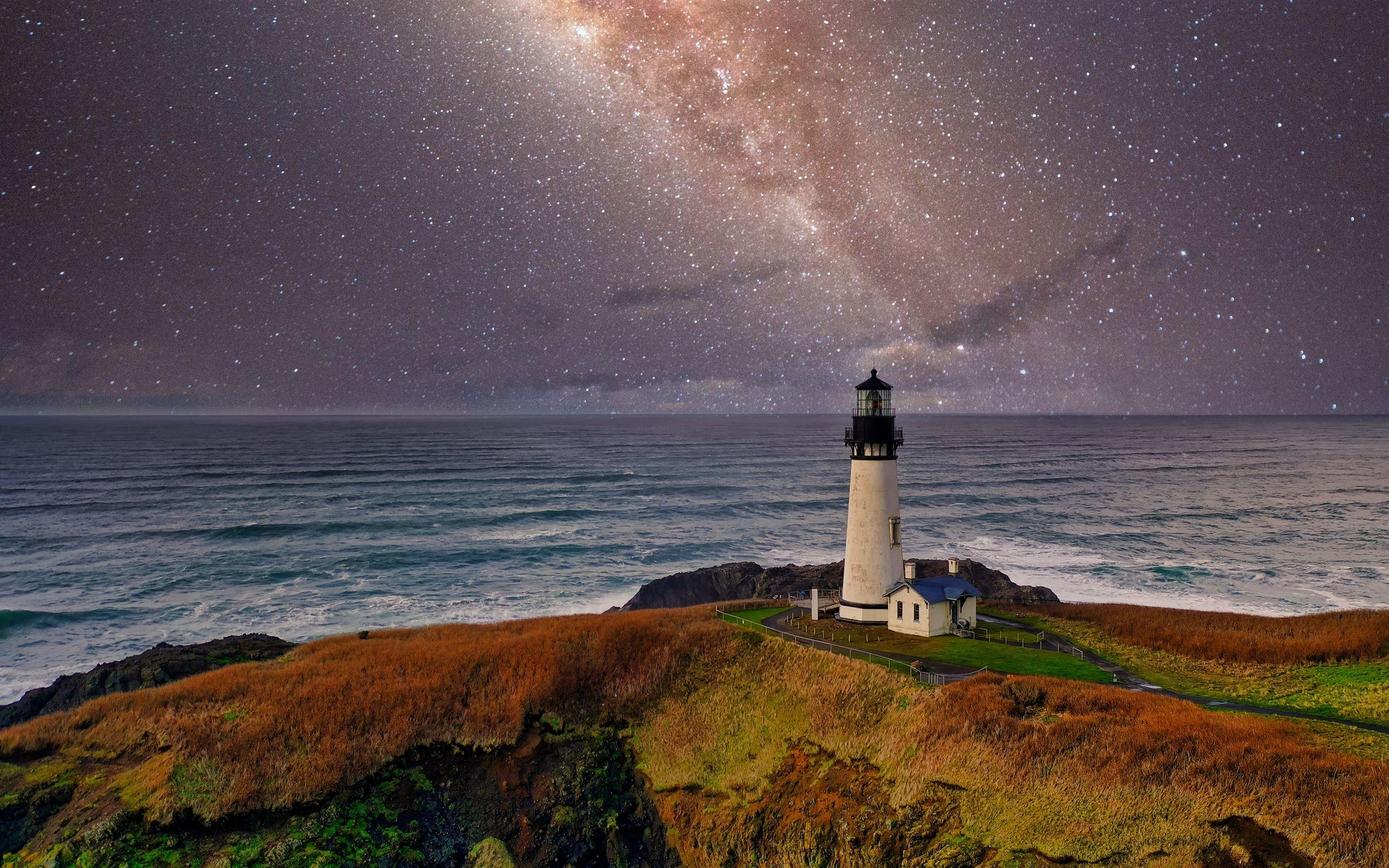 2560x1600 lighthouse under starry night MacBook Pro Wallpaper Download