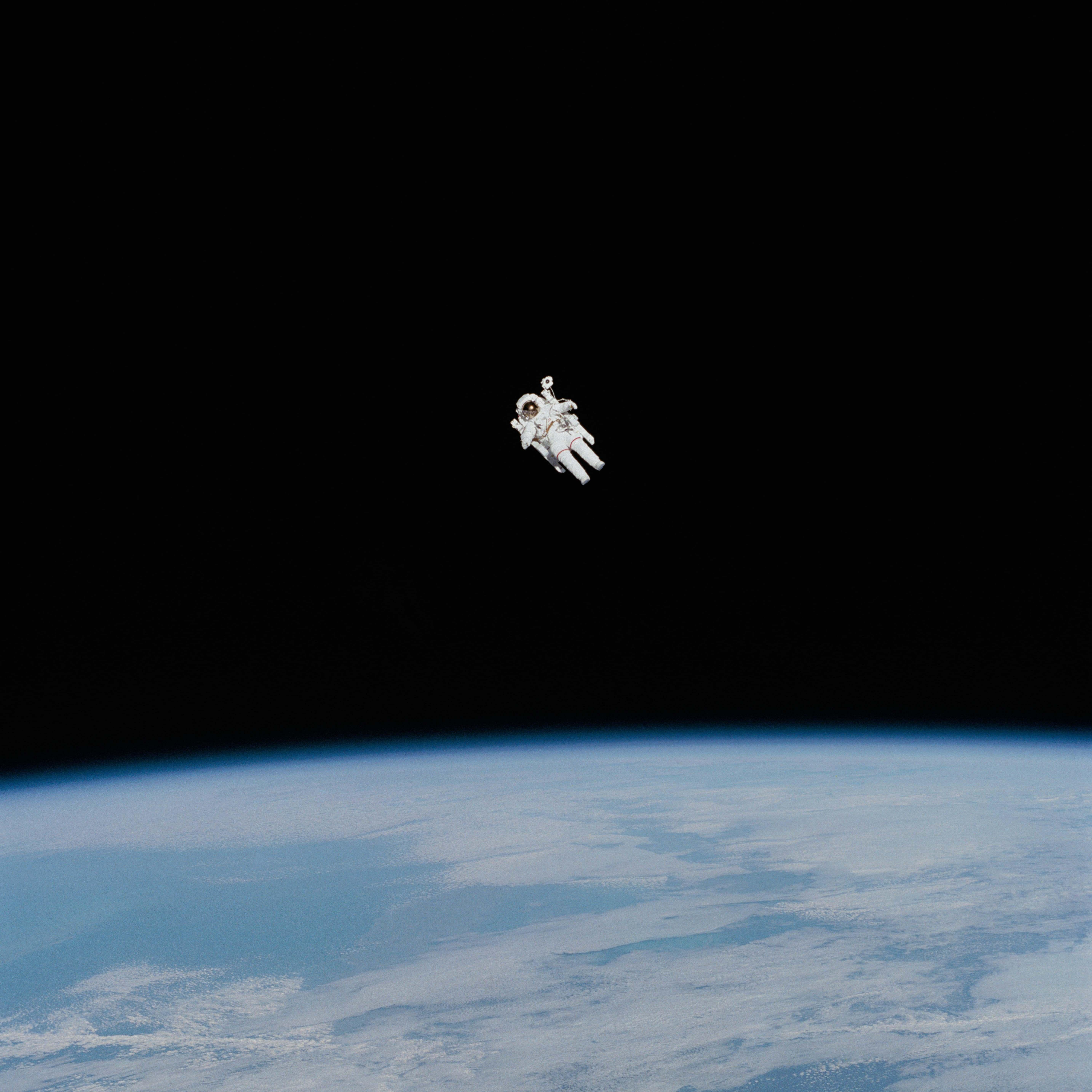 5735x5735 Space Astronaut In Spacesuit Floating In Space Universe Image