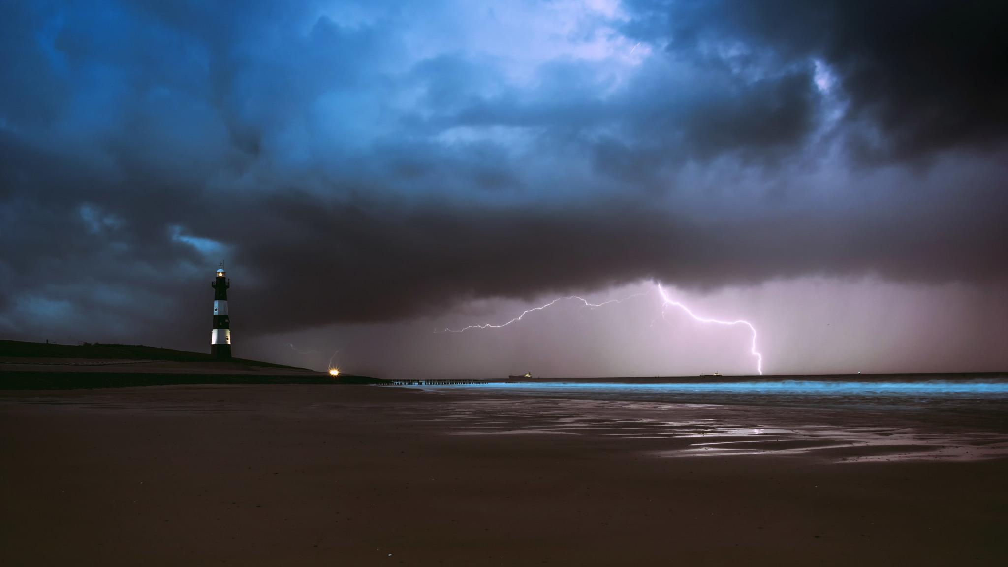 2048x1152 Lighthouse Lightning Sea Ocean Beach Weather 2048x1152 Resolution Wallpaper, HD Nature 4K Wallpaper, Image, Photo and Background