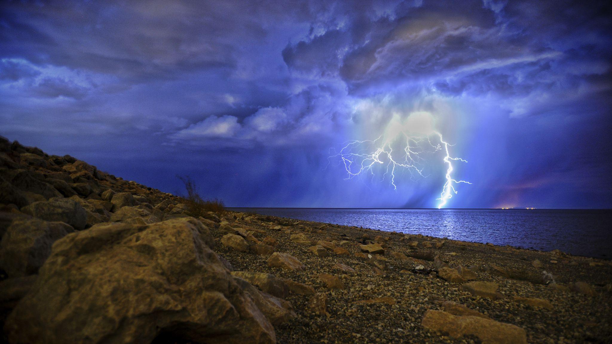 2048x1152 Download wallpaper 2048x1152 lightning, storm, lake, overcast, shore, night ultrawide monitor HD background