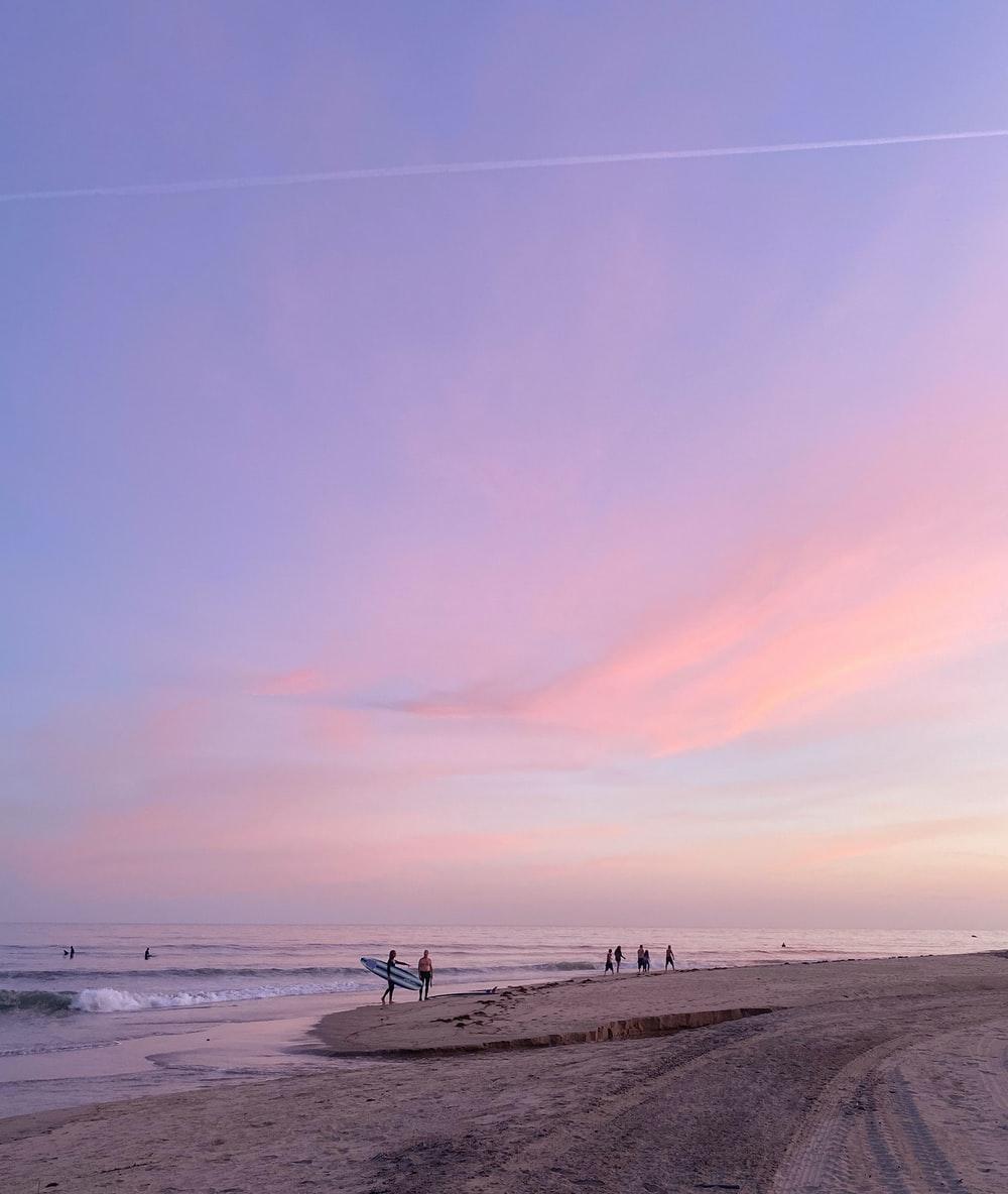 1000x1184 people walking on beach during daytime photo