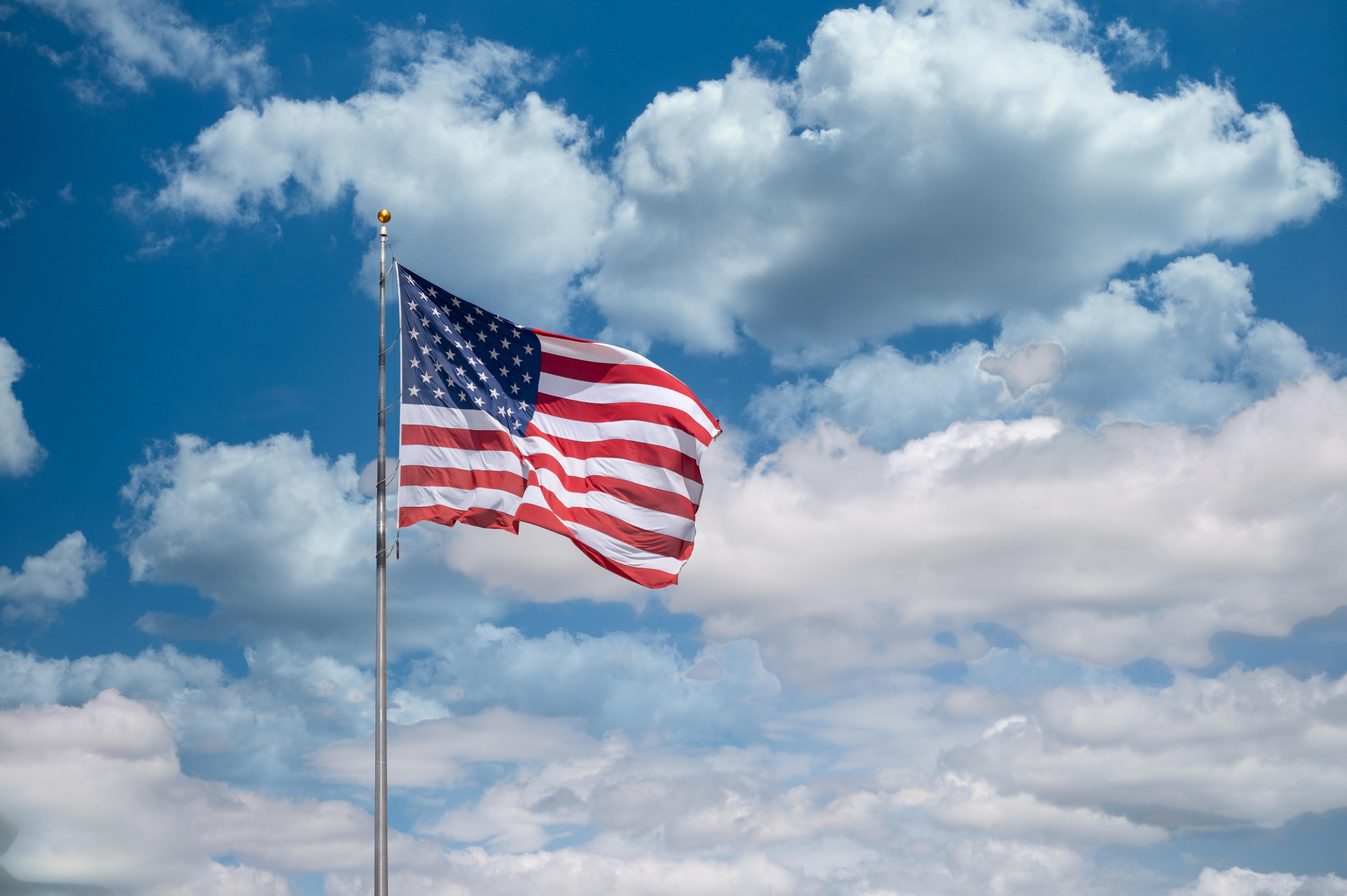 5398x3592 American Flag Under Blue Sky And White Clouds · Free