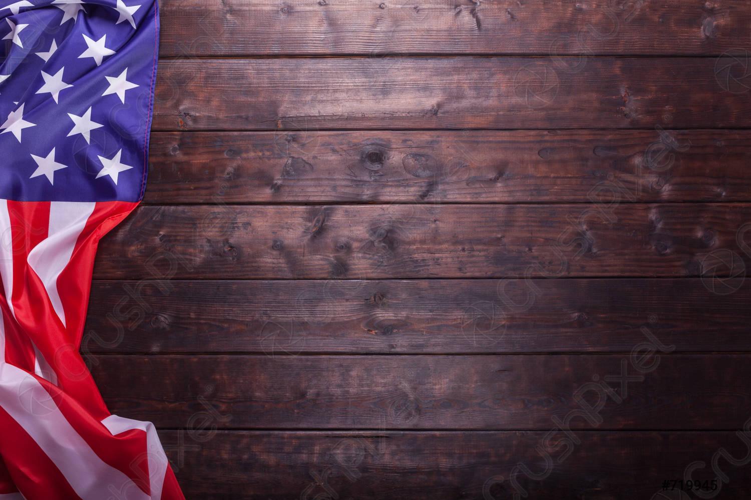 1500x1000 The American Flag Laying on a Wooden Background