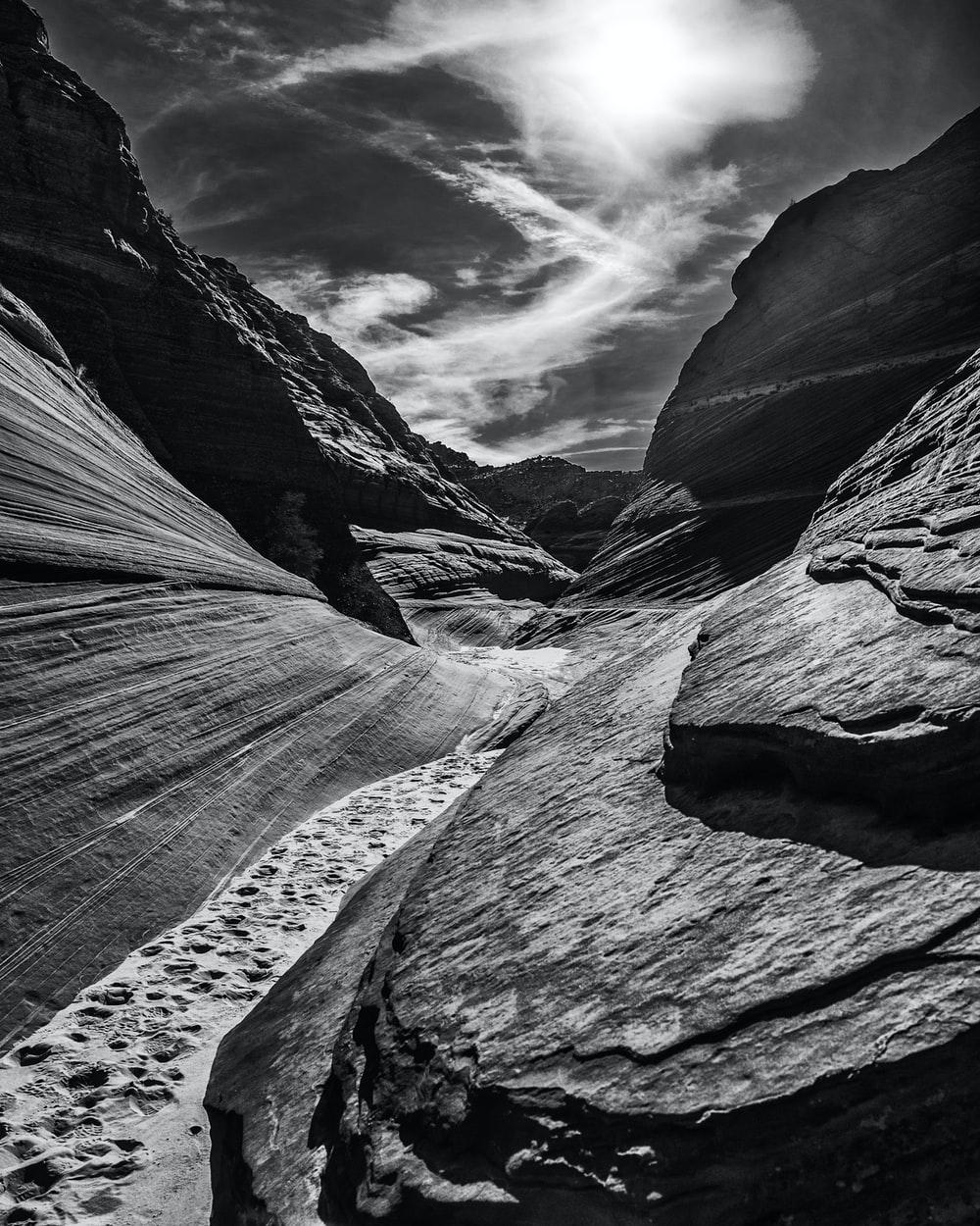 1000x1250 Darkened view from the bottom of a rocky canyon. photo