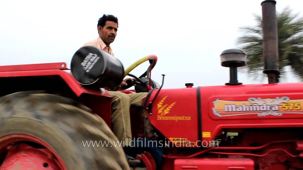 1280x720 Mahindra 575 Tractor Driven Through Old Fashioned Railway Check Post In North India