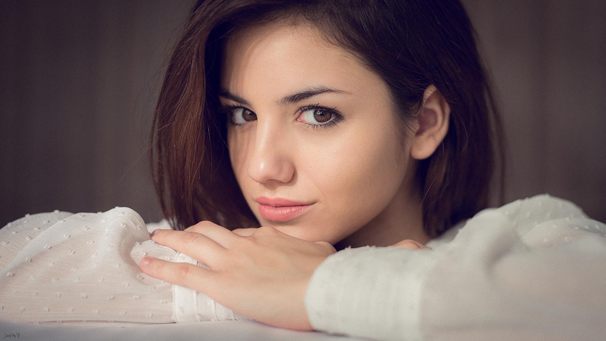 2048x1152 Women Brunette Face Brown Eyes White Clothing Closeup Portrait Natural Light Delaia Gonzalez David M Wallpaper:2048x1152
