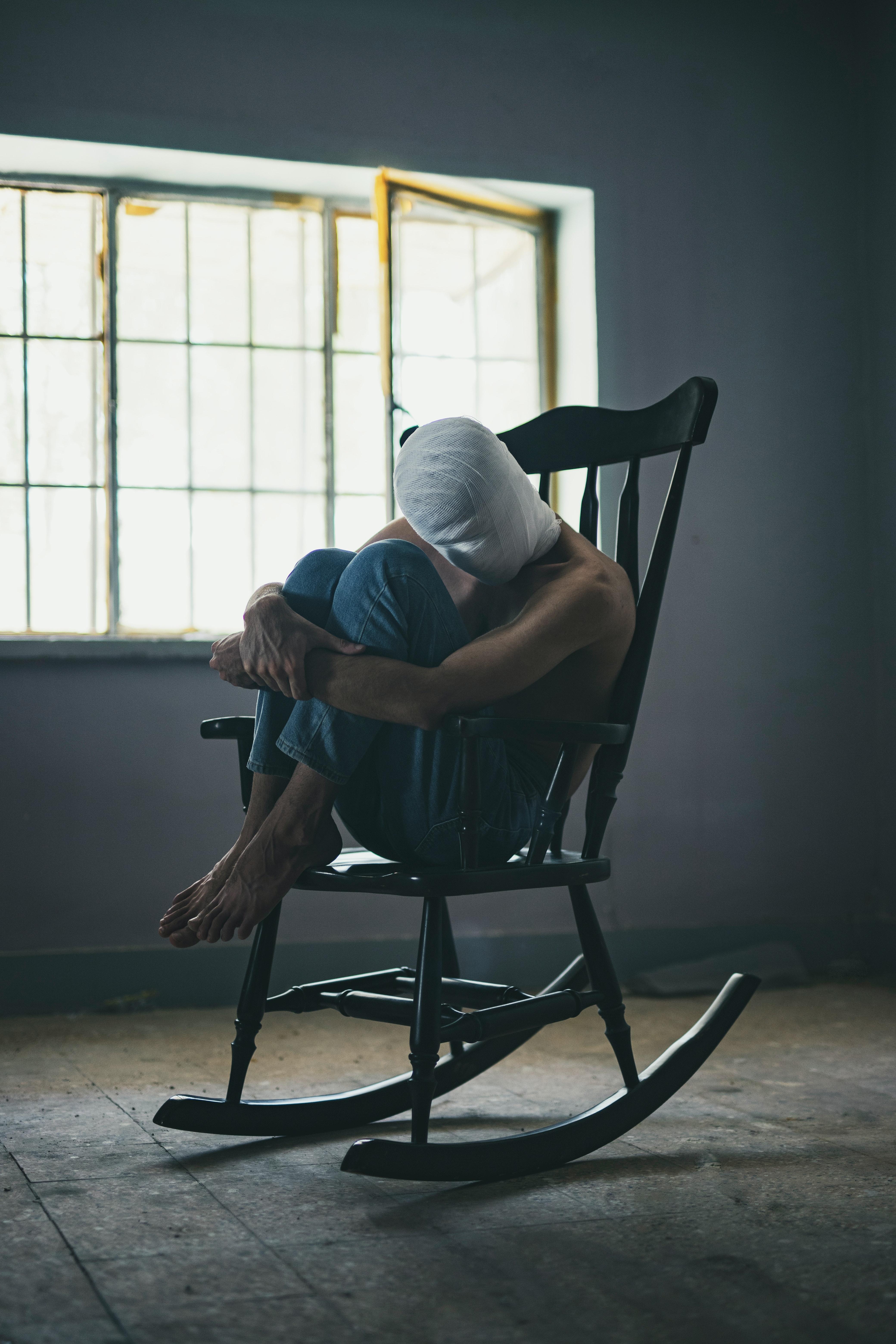 4160x6240 Person Sitting on Rocking Chair Inside Room · Free