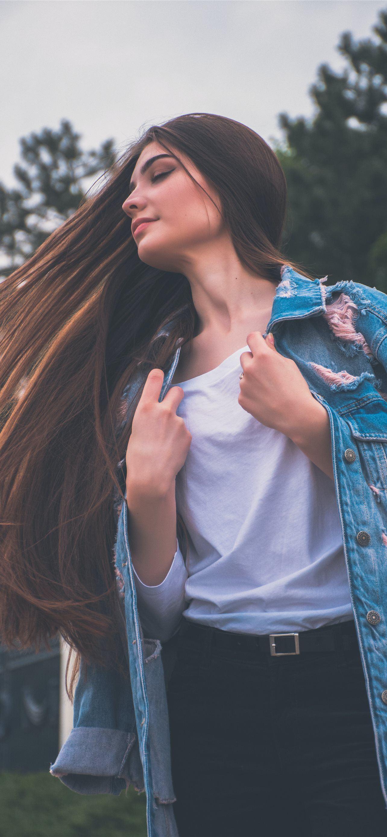 1284x2778 woman holding her white shirt flipping hair iPhone 12 Wallpaper Free Download