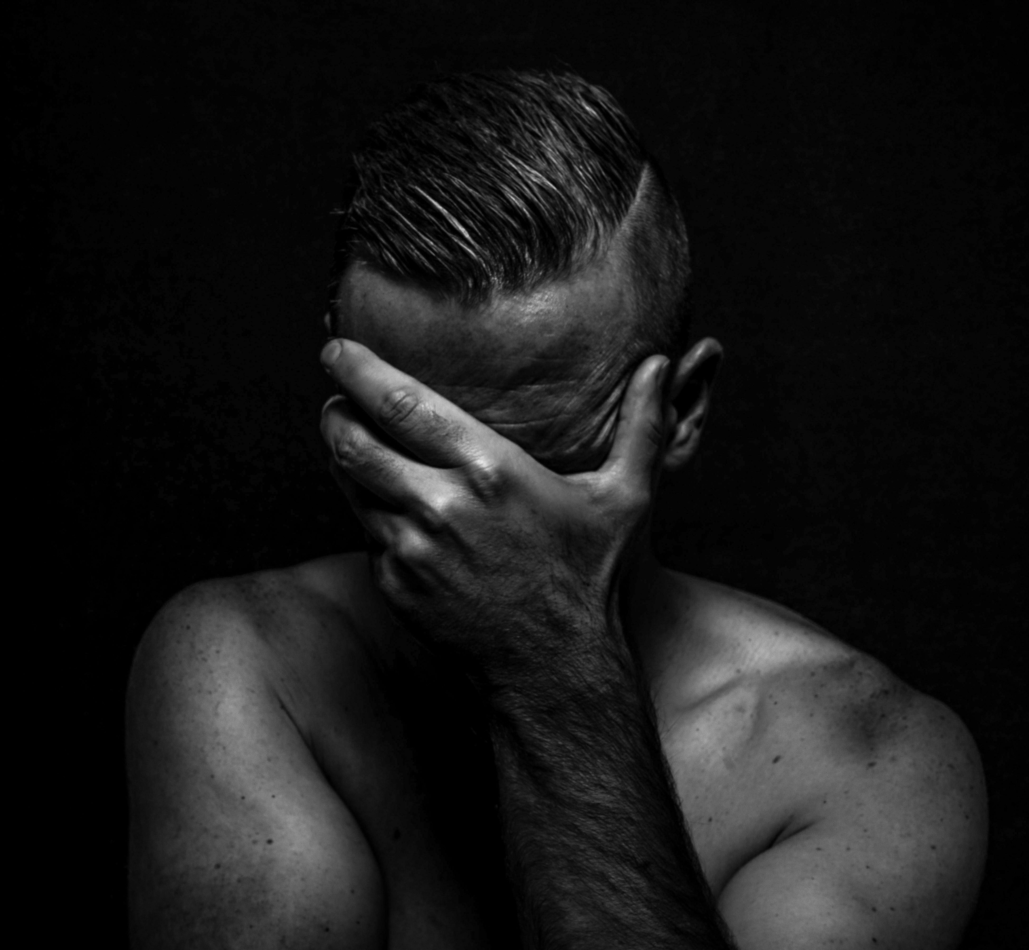 4333x4000 Anonymous depressed shirtless man with modern hairstyle on black background · Free