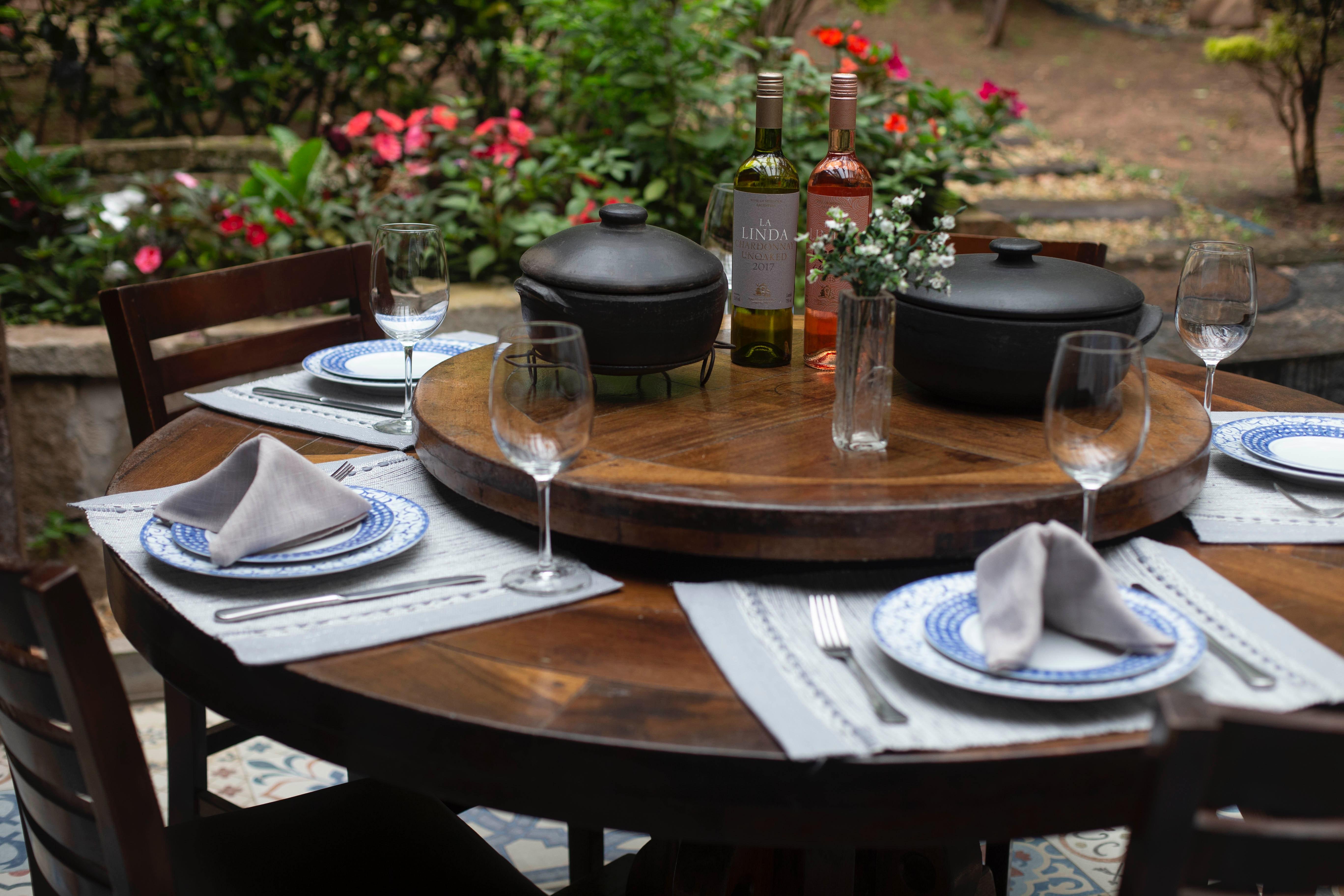 5472x3648 Dining Table Set With Plates, Water Goblet and Two Cooking Pots · Free