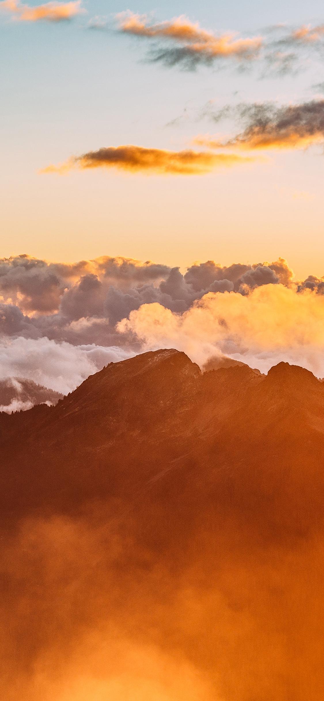 1125x2436 iPhone X wallpaper. red mountain morning fog sky