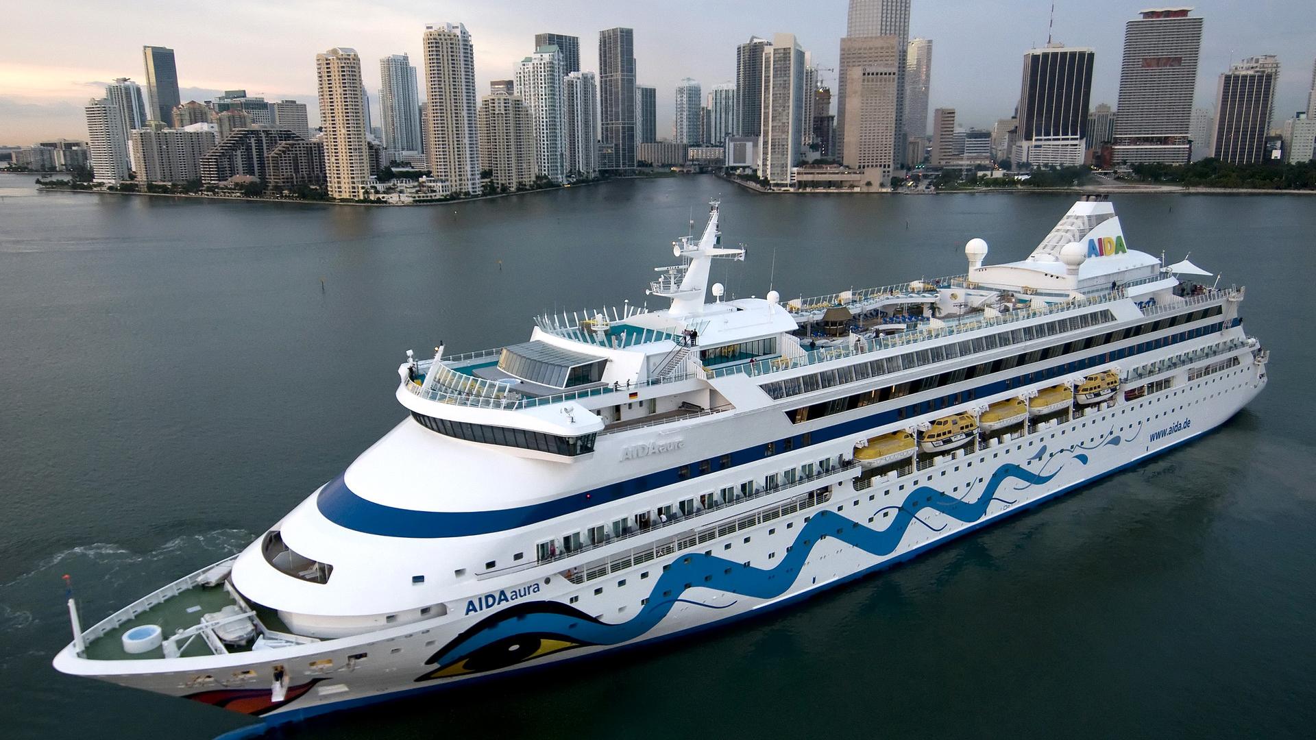 1920x1080 Aerial View Of AIDA Aura Cruise Ship With Background Of High Rising Buildings HD Cruise Ship Wallpaper