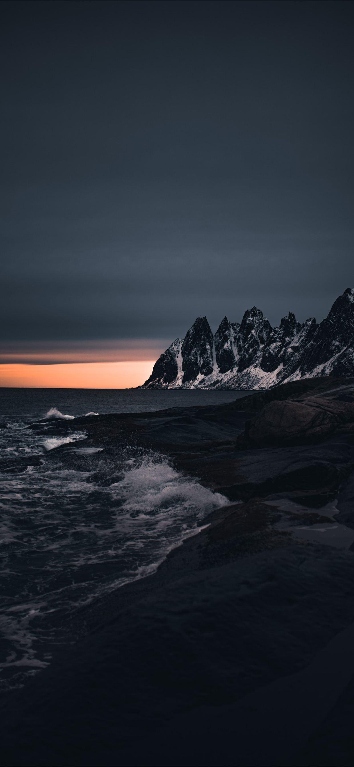 1242x2688 rocky mountain near body of water during sunset iPhone 11 Wallpaper Free Download