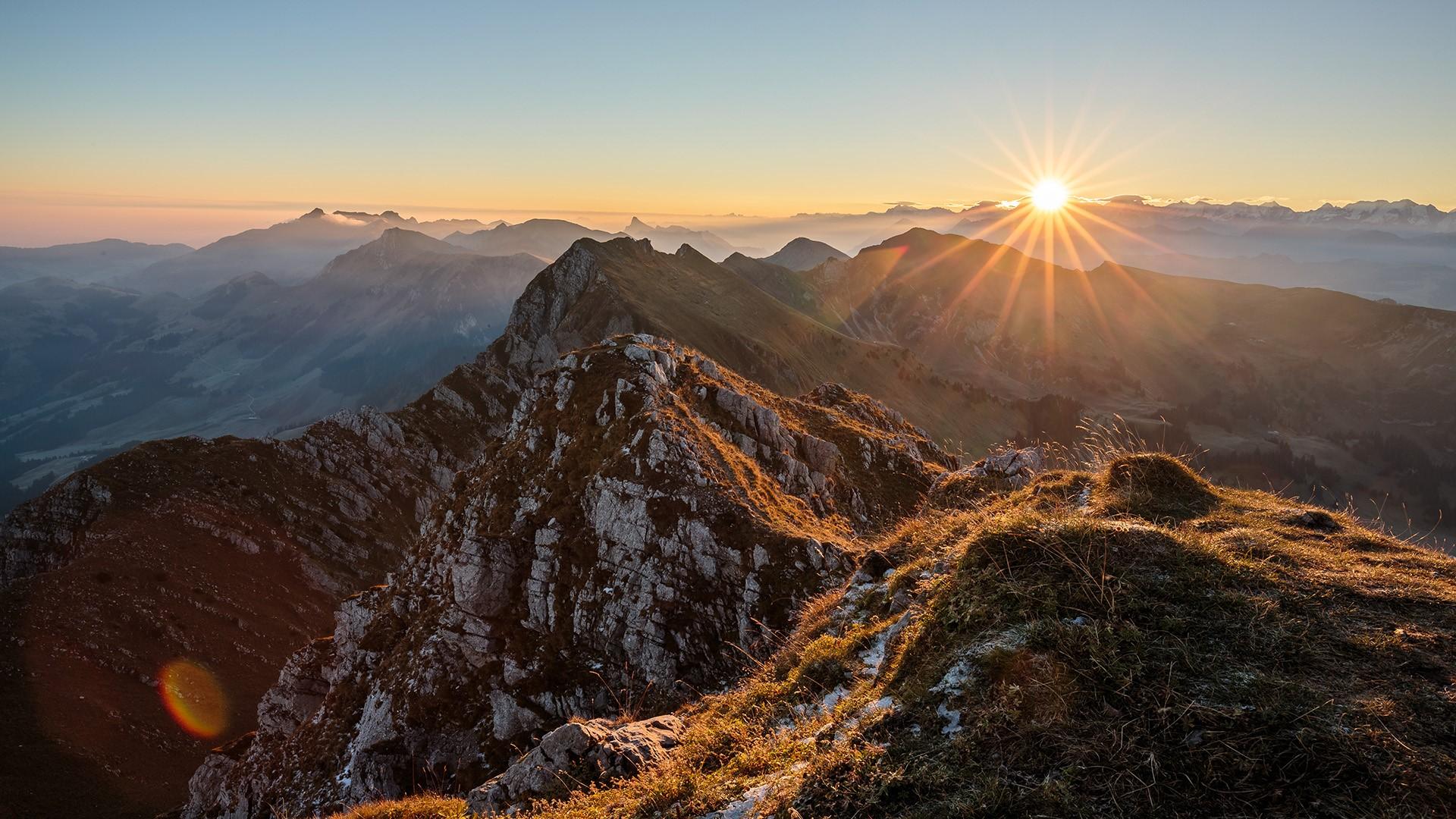 1920x1080 Scenic view of rocky mountains during sunset, Swiss Alps, Switzerland. Windows 10 Spotlight Image