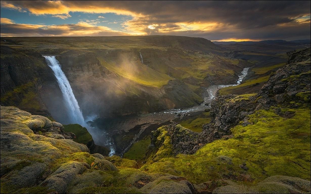 1230x768 nature landscape waterfall canyon river sunset clouds mist grass summer iceland sky wallpaper