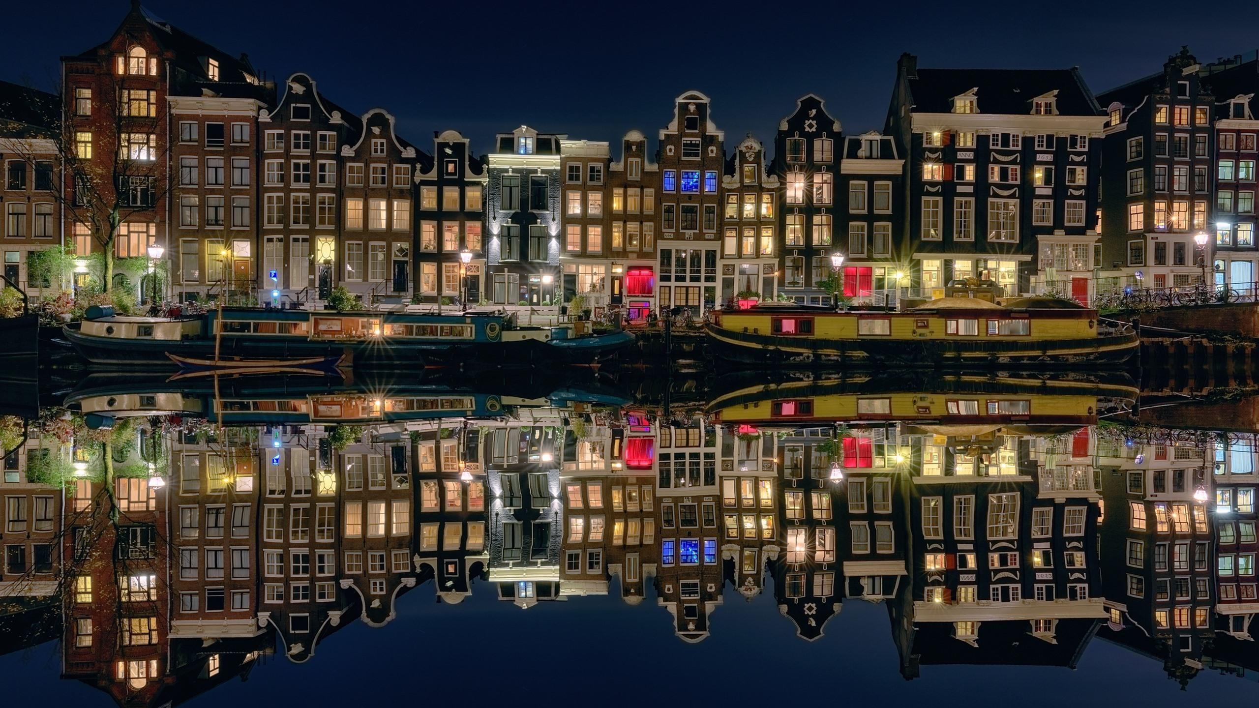 2560x1440 Wallpaper Amsterdam, Netherlands, night city, houses, boats, river, lights 2560x1600 HD Picture, Image