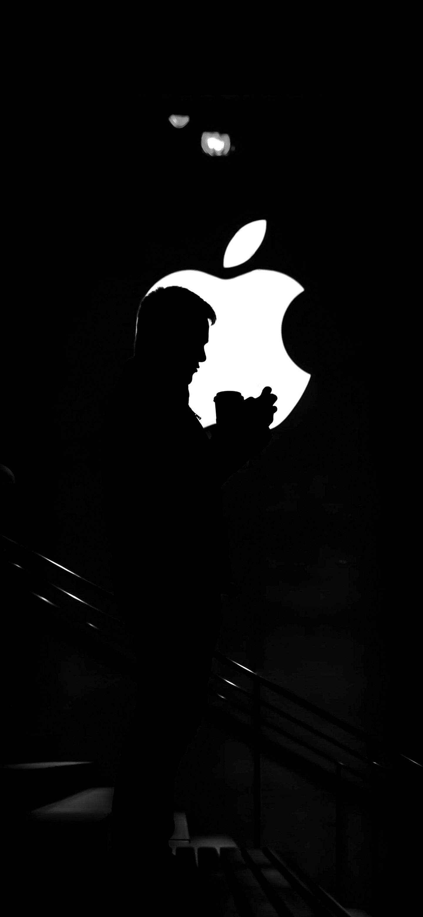 1440x3120 Man standing in front of Apple Logo. Wallpaper, Apple logo, Man standing