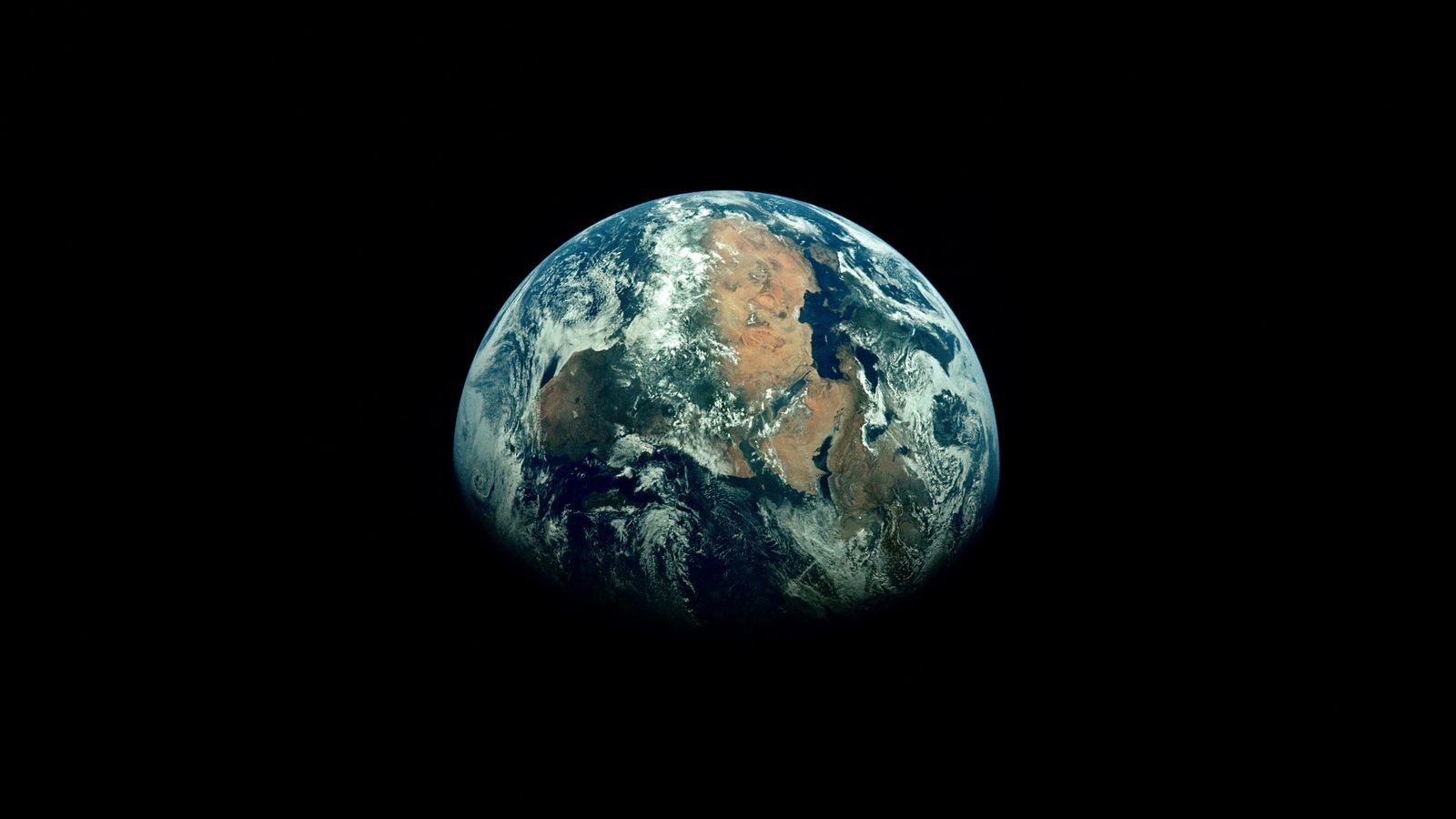 1600x900 Download wallpaper 1600x900 earth, planet, shadow, black, space widescreen 16:9 HD background