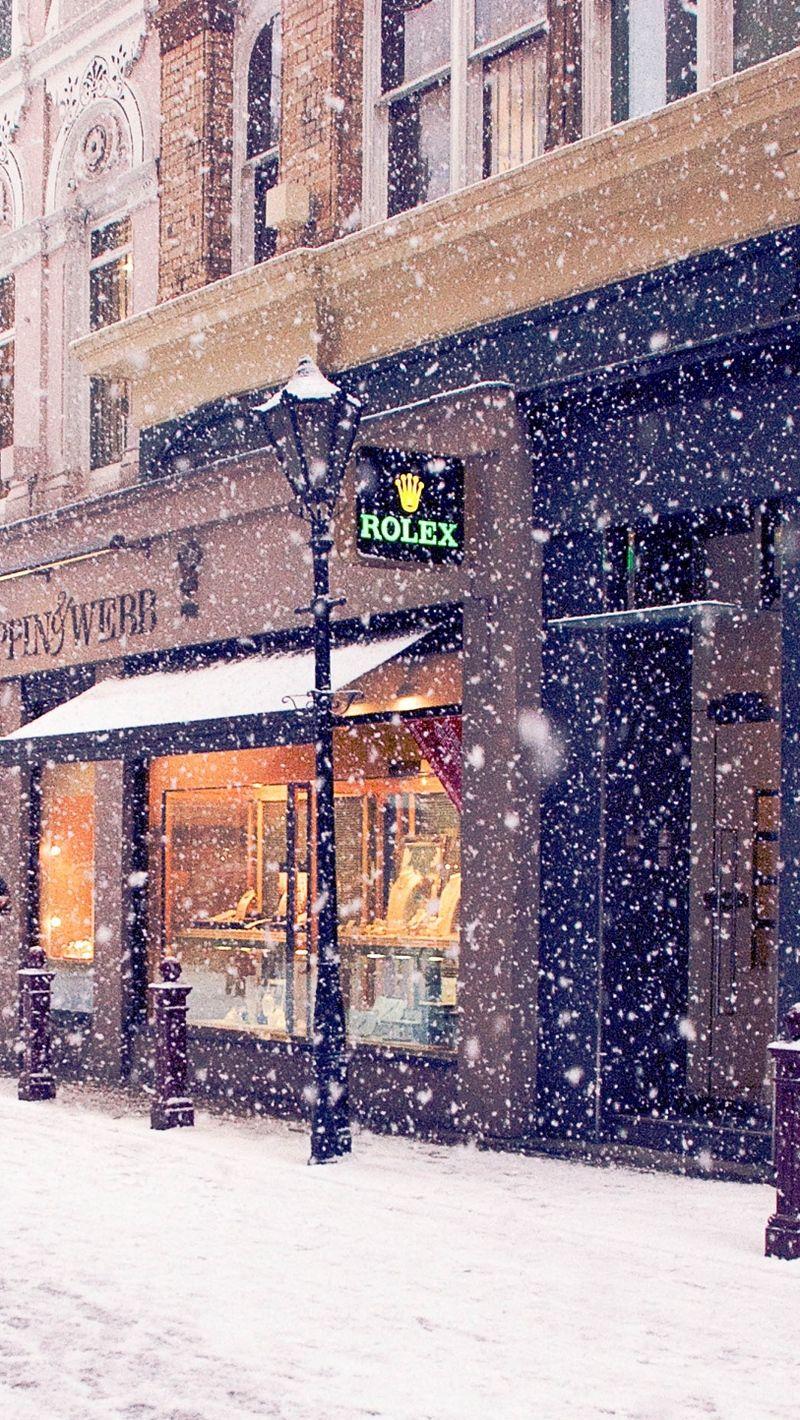 800x1420 Download wallpaper 800x1420 city, winter, europe, street, snow
