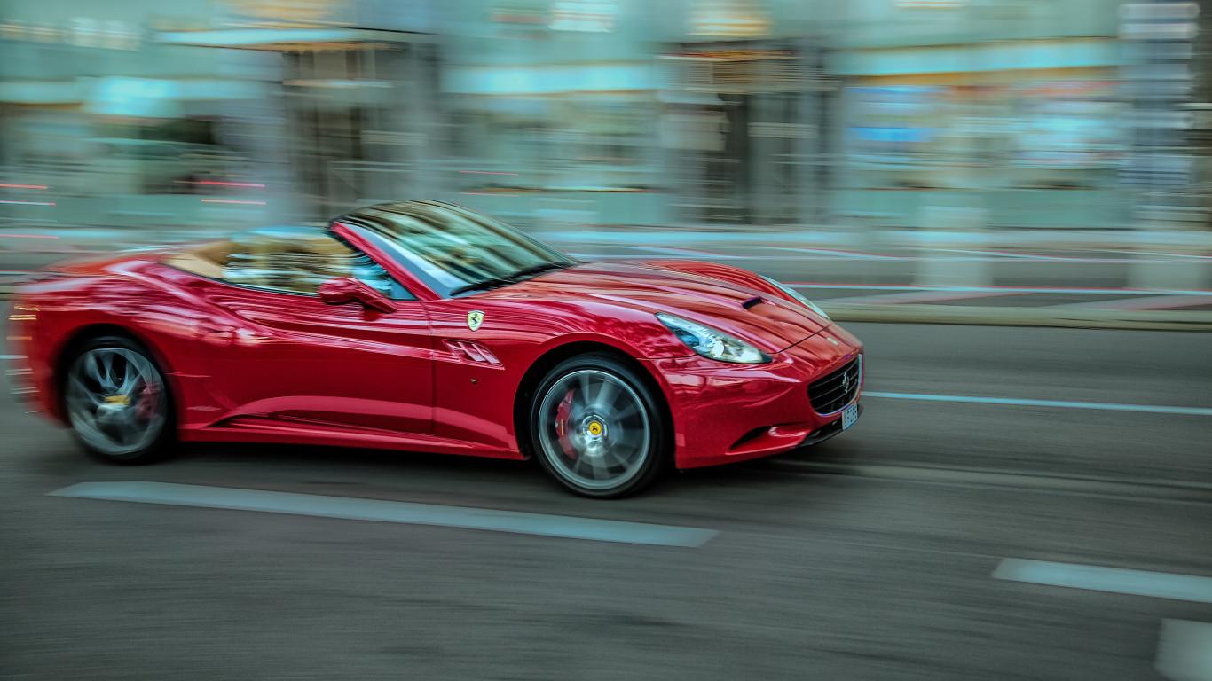 1366x768 Download wallpaper: Ferrari in motion 1366x768
