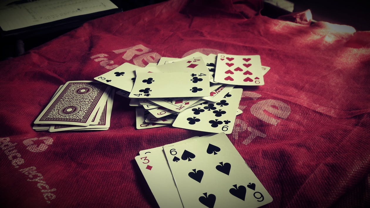 1260x709 White Gaming Cards On Red Bag HD Wallpaper