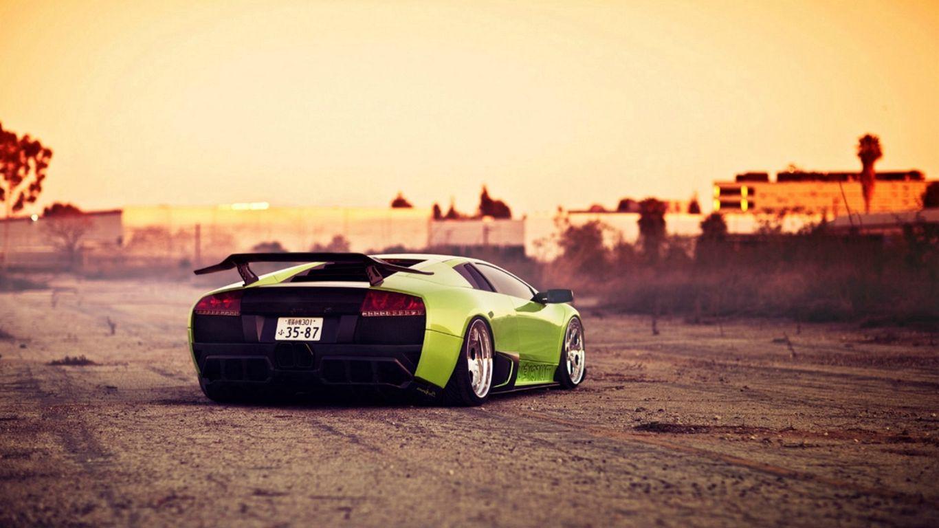 1366x768 Download wallpaper 1366x768 green, bright, city, lamborghini tablet, laptop HD background