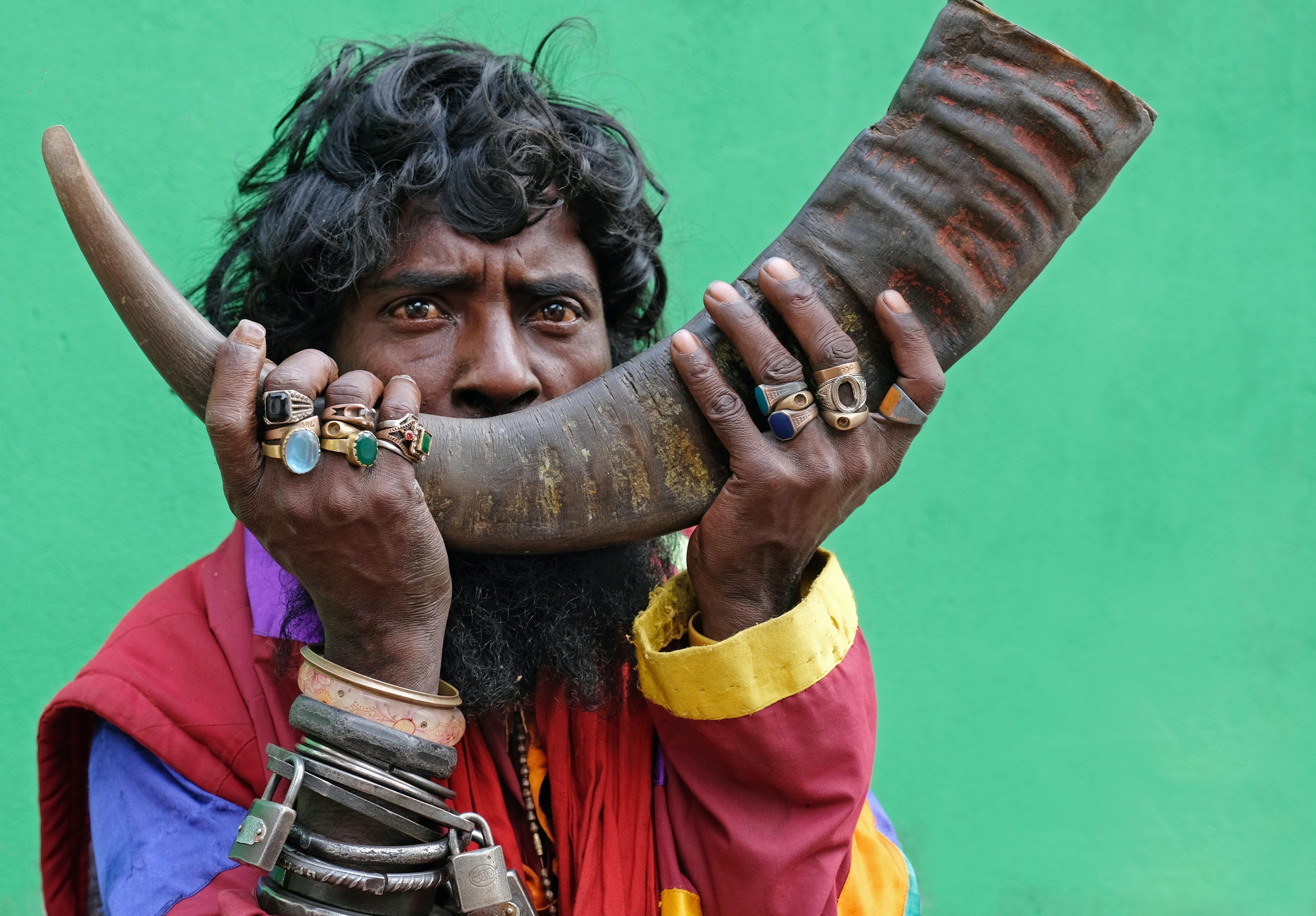 5080x3536 Man Holding a Animal Horn · Free