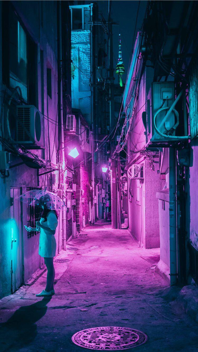 750x1334 woman holding umbrella while standing outside of b. iPhone 8 Wallpaper Free Download