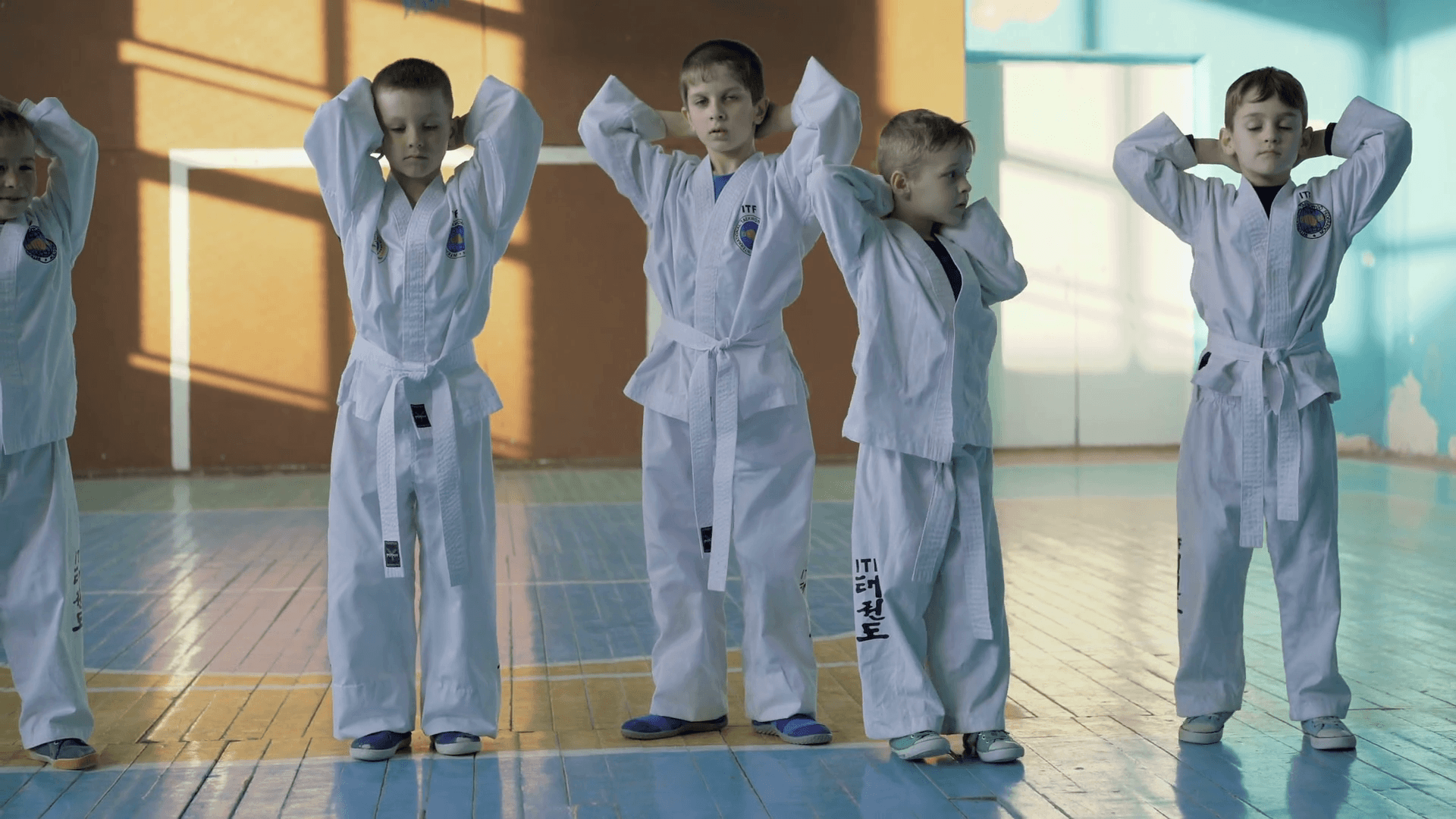 1920x1080 Funny male kids training a taekwondo in the gym in 4K Stock Video