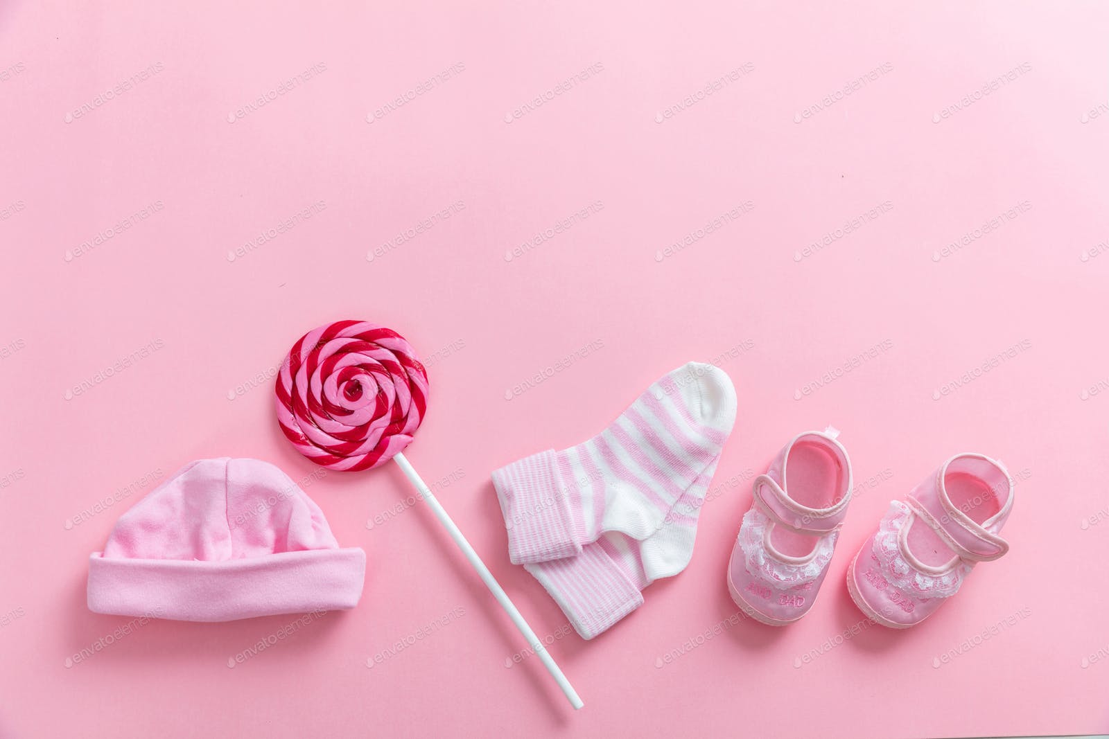 1600x1067 Baby girl shoes and socks on pink background photo by rawf8 on Envato Elements