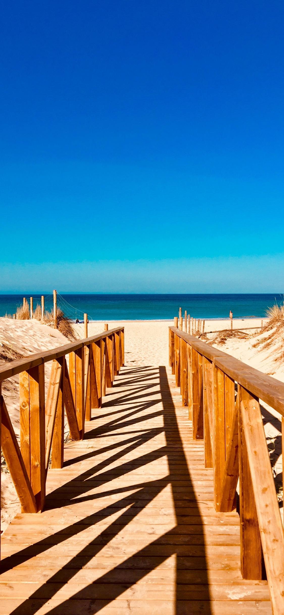 1125x2436 Download 1125x2436 wallpaper wooden dock, sea, beach, sunny day, iphone x 1125x2436 HD image, background, 19112