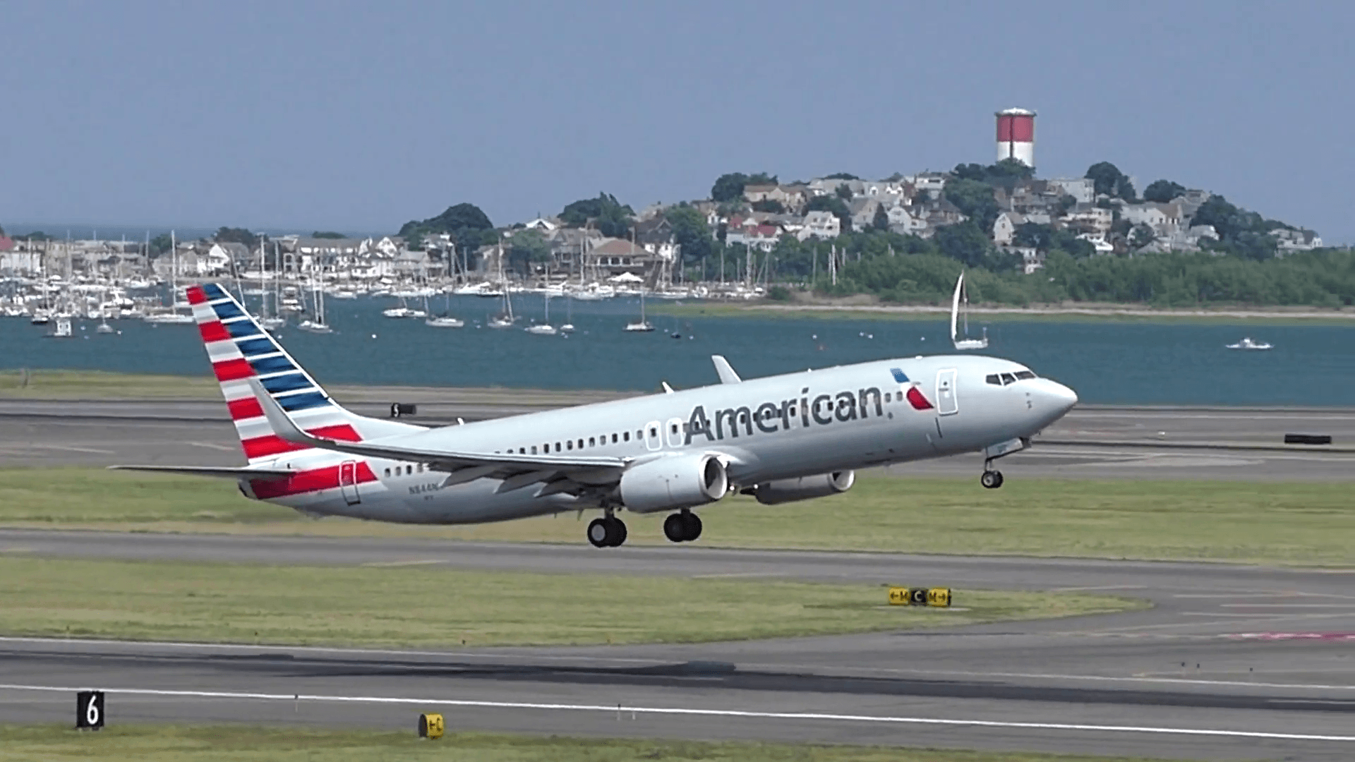 1920x1080 American Airlines plane lifts off from airport runway slow motion