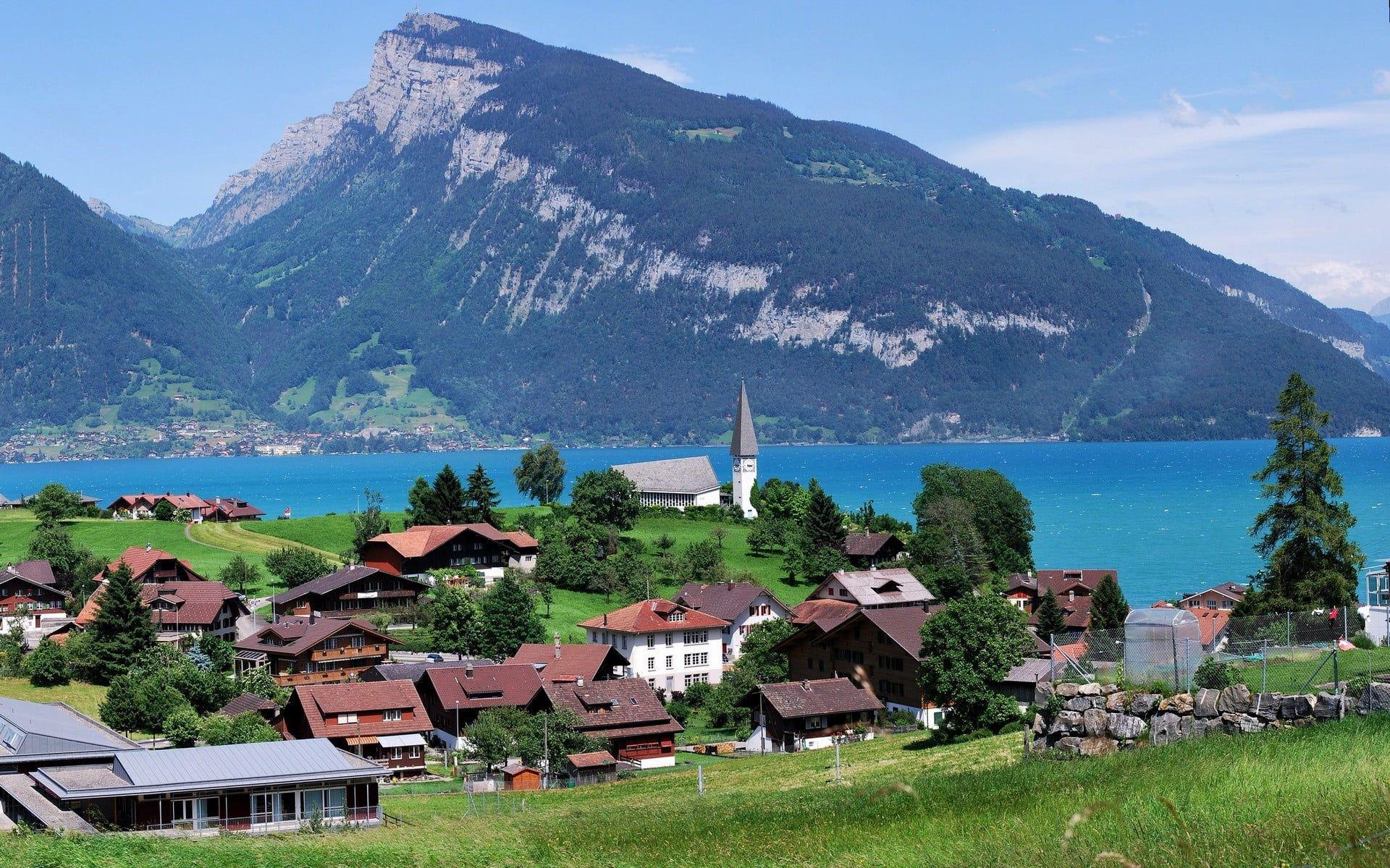 1920x1200 urban city Lake Thun #Switzerland #village #lake #mountains P # wallpaper #hdwallpaper #desktop. Mountain vacations, Town lake, Lake thun