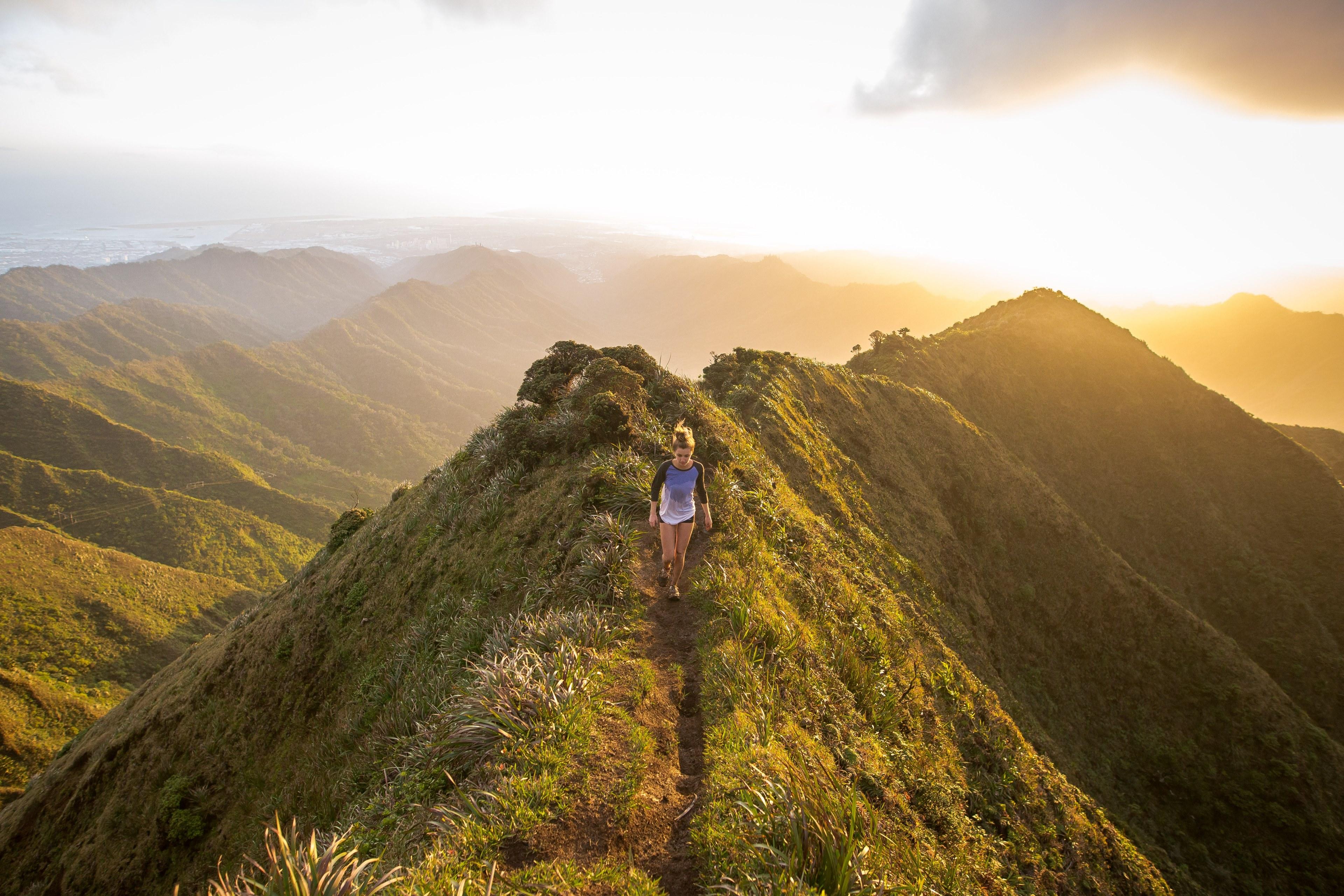 3840x2560 Wallpaper / a woman hiking along the top of a grassy mountain with the sunset in the background, mountain hiking sunset follow kalenemsley on ig 4k wallpaper