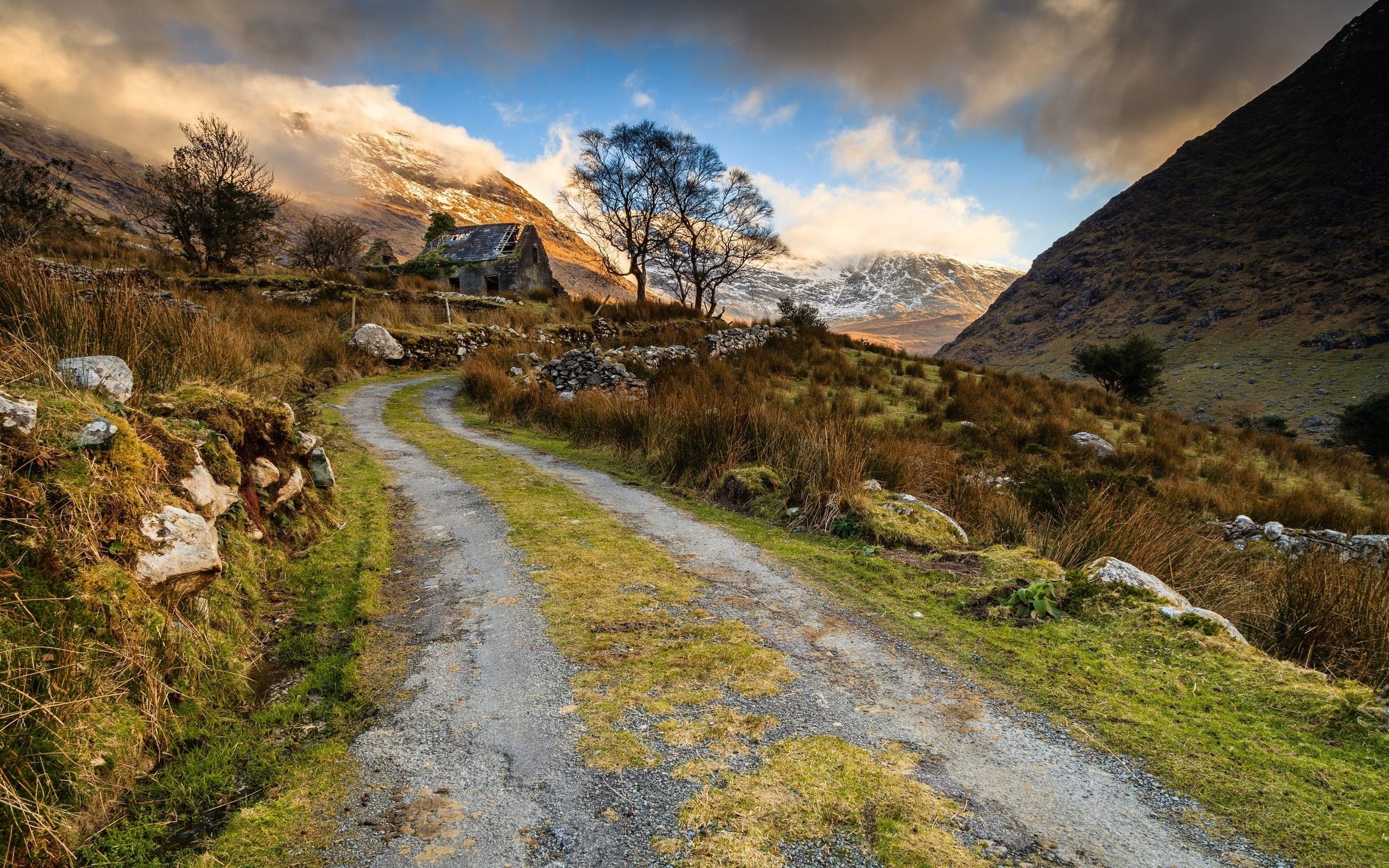 2500x1563 nature landscape abandoned house old road mountain grass trees clouds snowy peak ruin building shrubs stones wallpaper