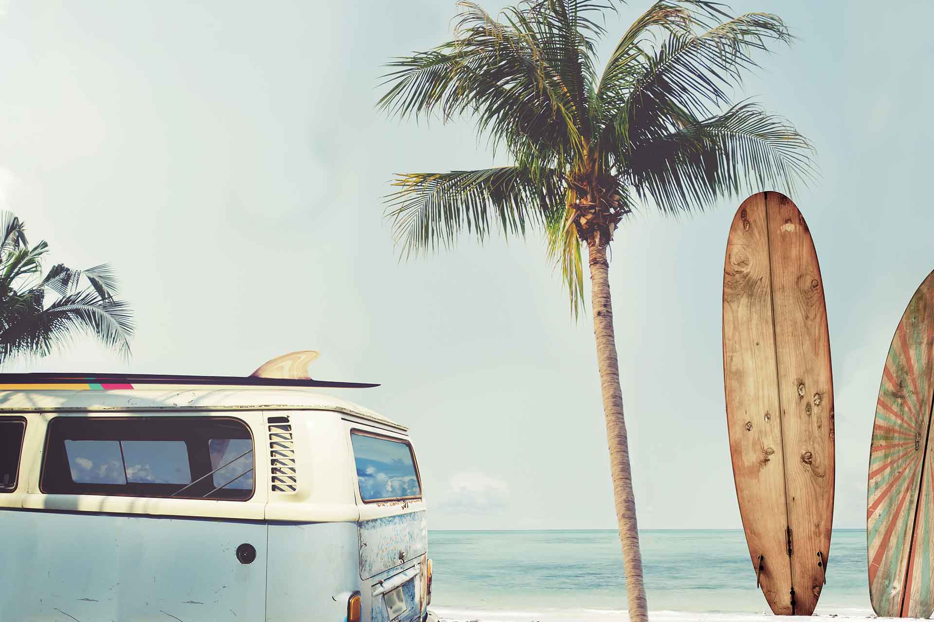 1920x1280 A wallpaper of a collage of a beach with palm trees, surfboards and a blue hippie van. Cara Saven Wall Design