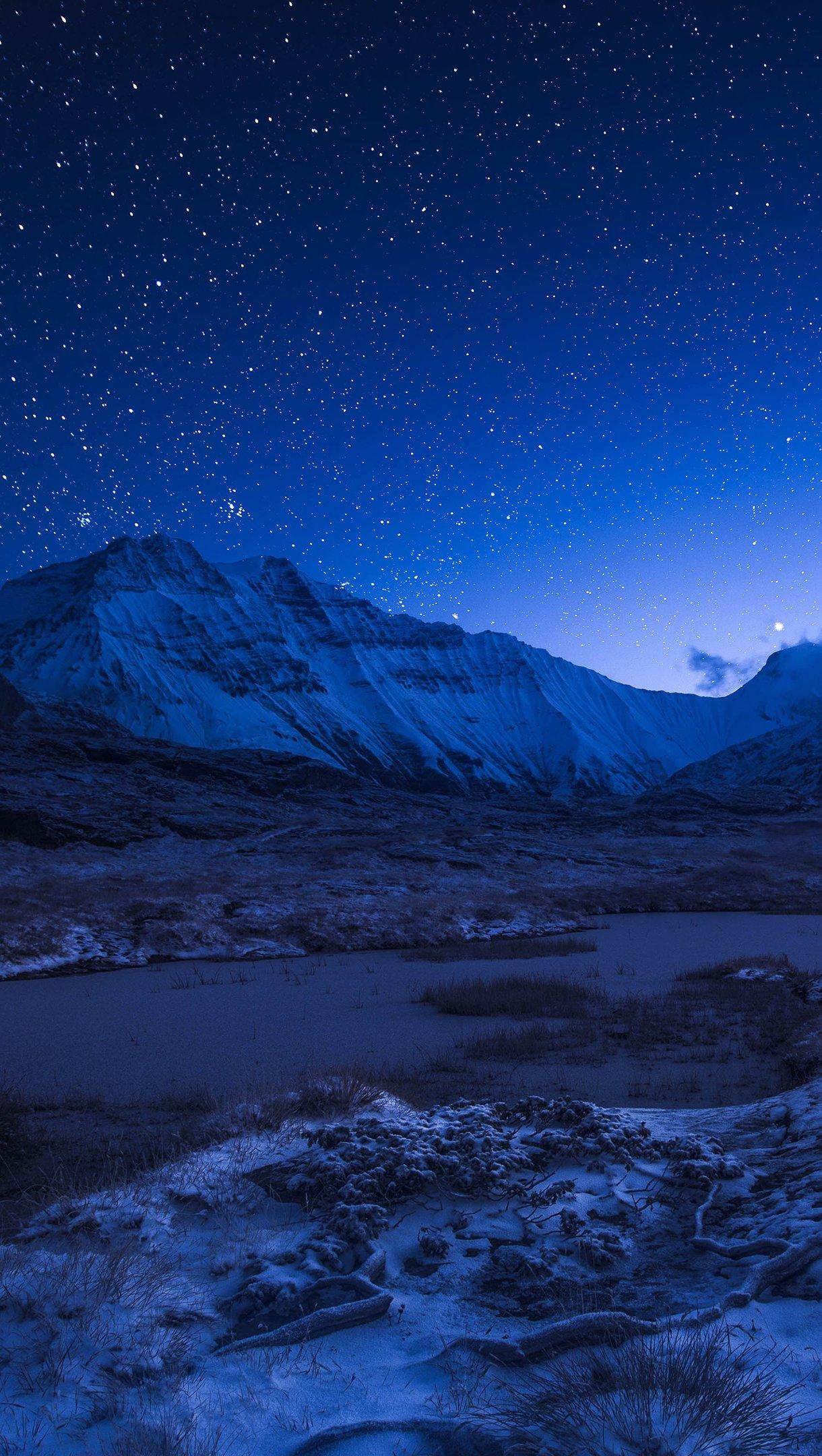 1220x2160 Starry night sky above the snowy mountains Wallpaper 4k Ultra HD