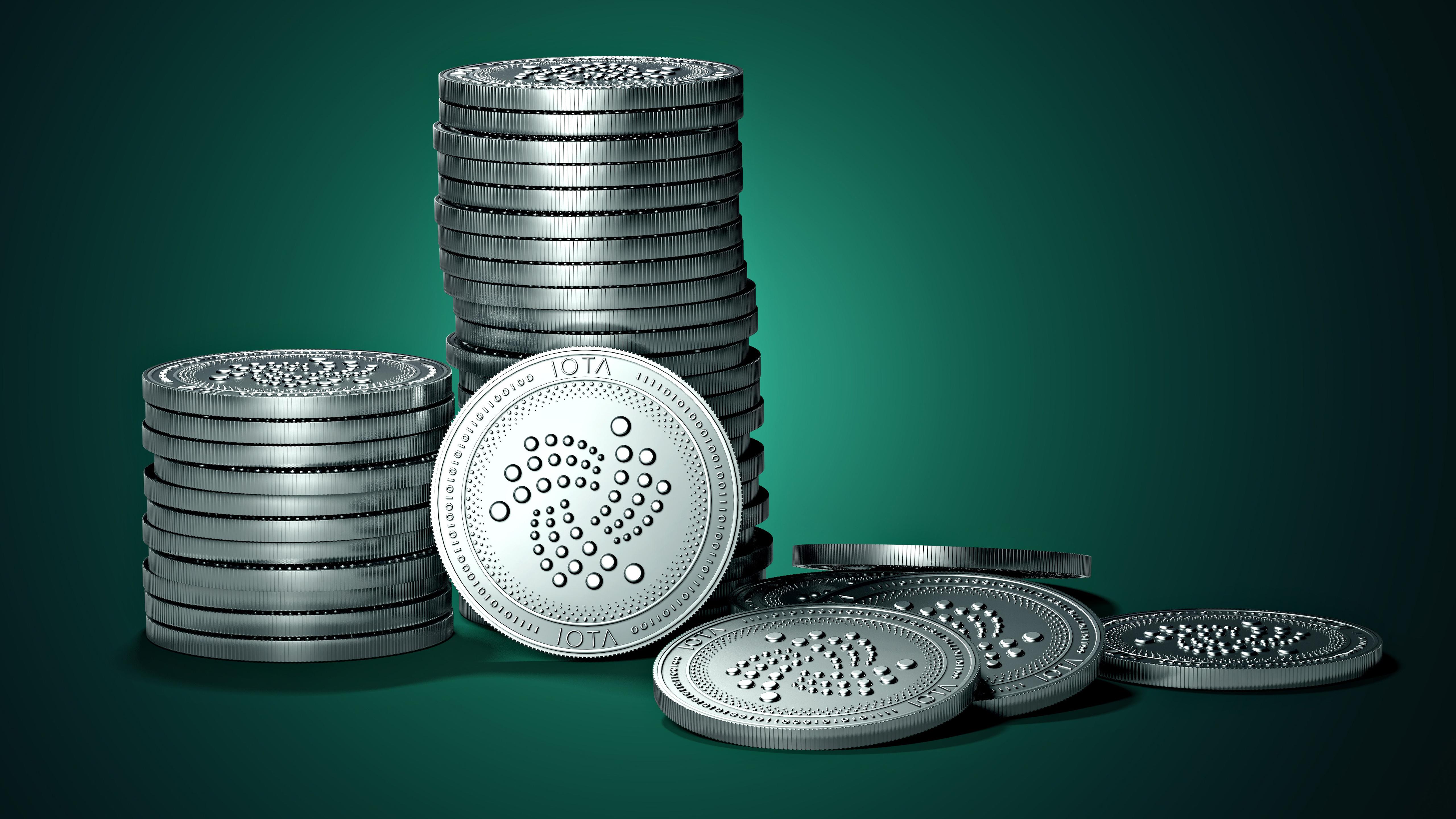 5120x2880 Cryptocurrency Silver IOTA Coins In Green Background 4K 5K HD Money Wallpaper