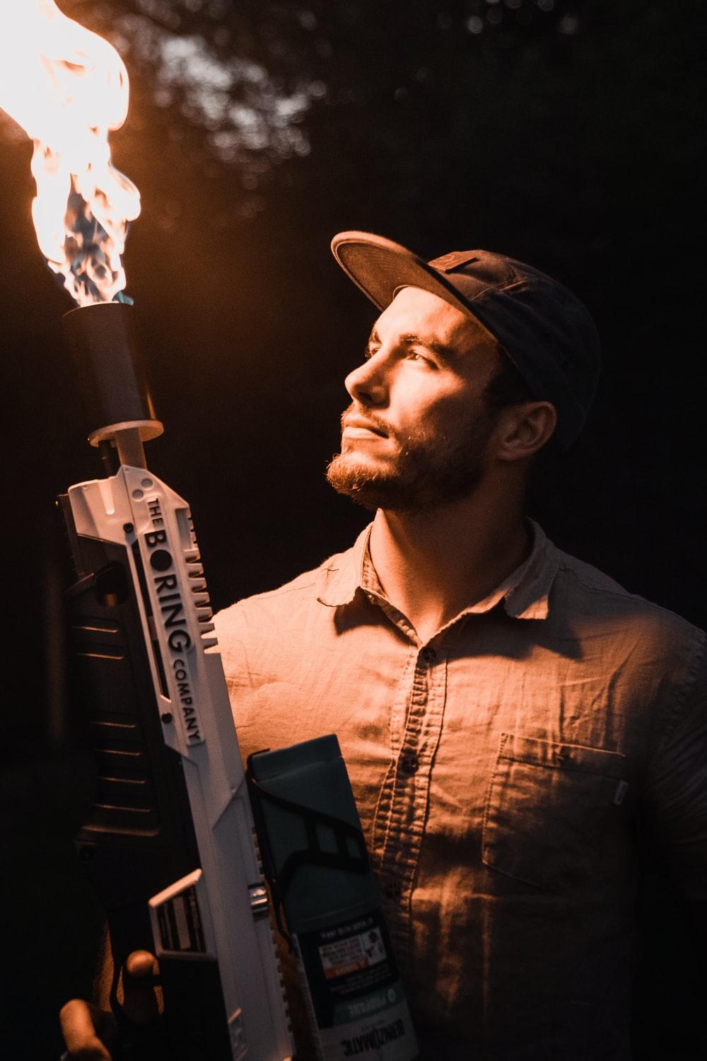 1000x1500 man holding flamethrower photo