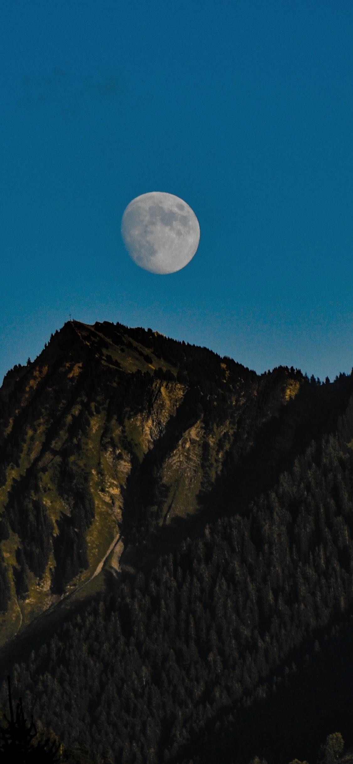 1125x2436 Download 1125x2436 wallpaper evening, moon, mountains, iphone x 1125x2436 HD image, background, 18133