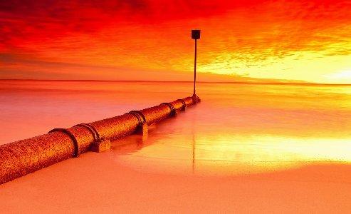 493x300 Seascapes Nature Ocean Sea Water Sunset Sunrise Pipes Signs Skies Clouds Colors Bright Reflection Desktop Background Wallpaper