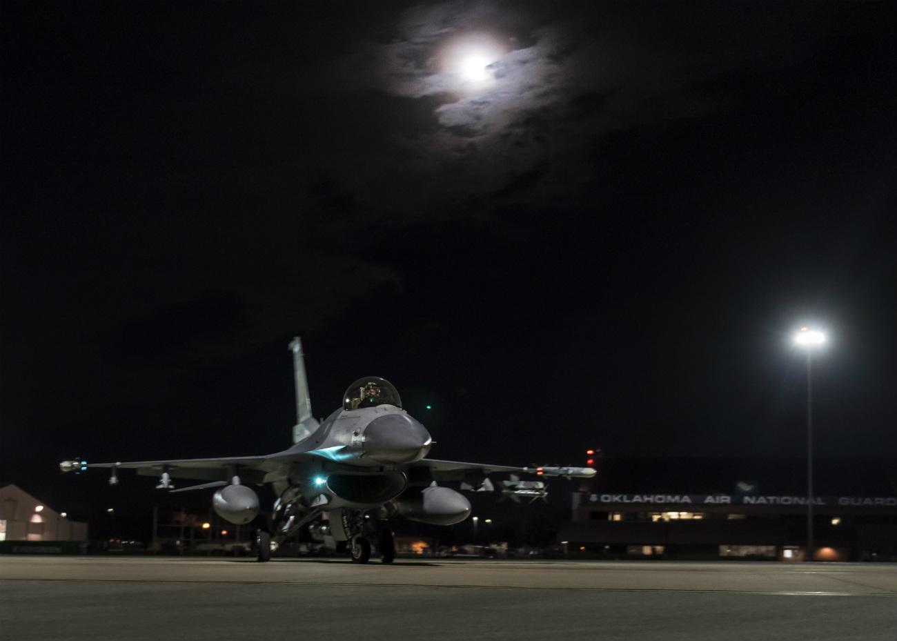 1300x929 Captivating Image of US Military Aircraft at Night